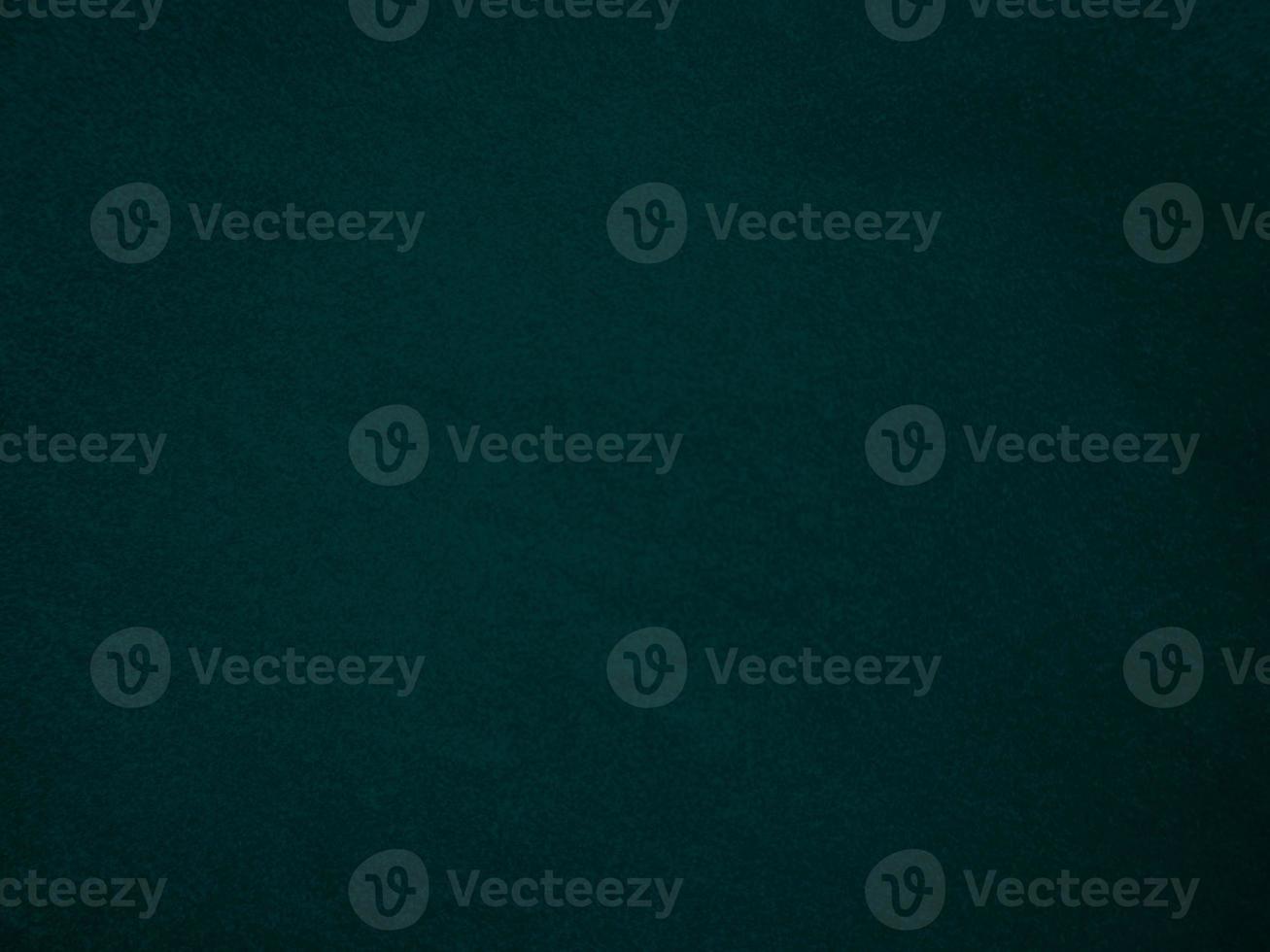 Dark green old velvet fabric texture used as background. Empty green fabric background of soft and smooth textile material. There is space for text.. photo