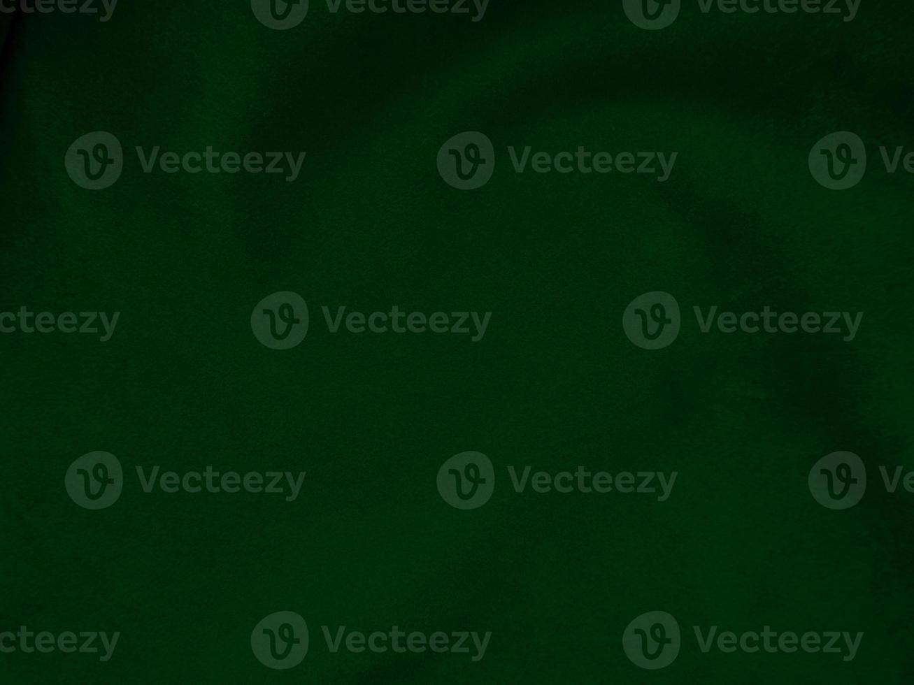 Dark green old velvet fabric texture used as background. Empty green fabric background of soft and smooth textile material. There is space for text.. photo