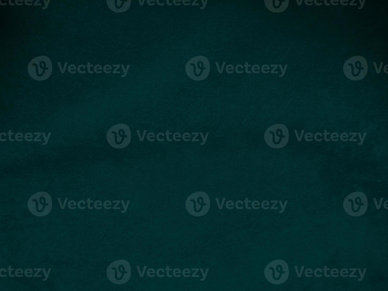 Dark green old velvet fabric texture used as background. Empty green fabric background of soft and smooth textile material. There is space for text.. photo