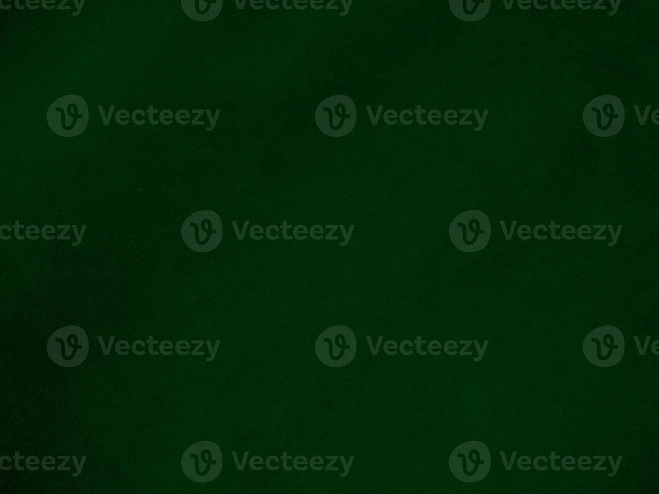 Dark green old velvet fabric texture used as background. Empty green fabric background of soft and smooth textile material. There is space for text.. photo