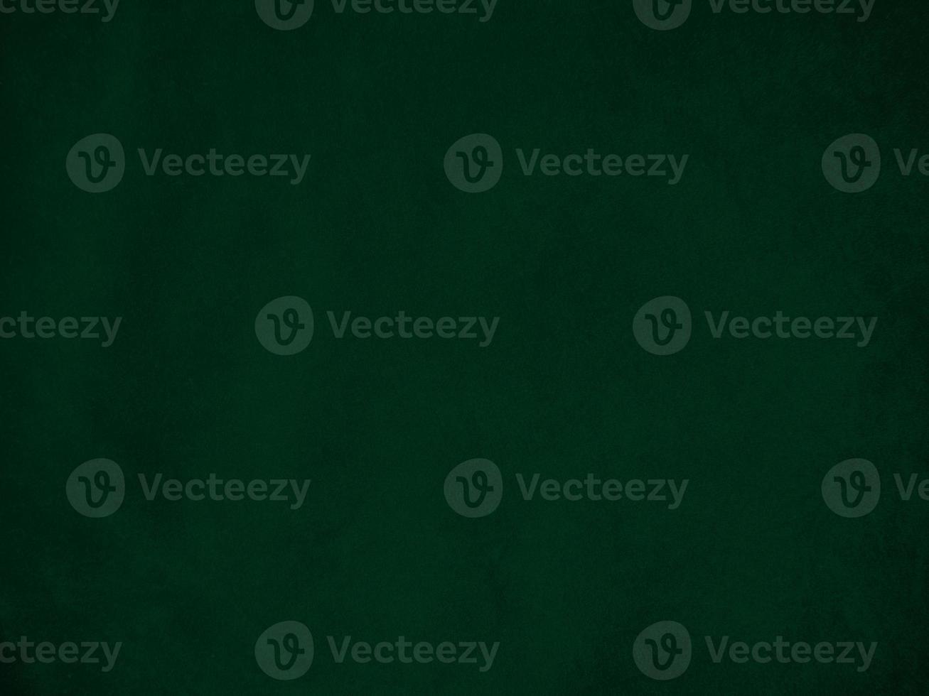 Dark green old velvet fabric texture used as background. Empty green fabric background of soft and smooth textile material. There is space for text.. photo