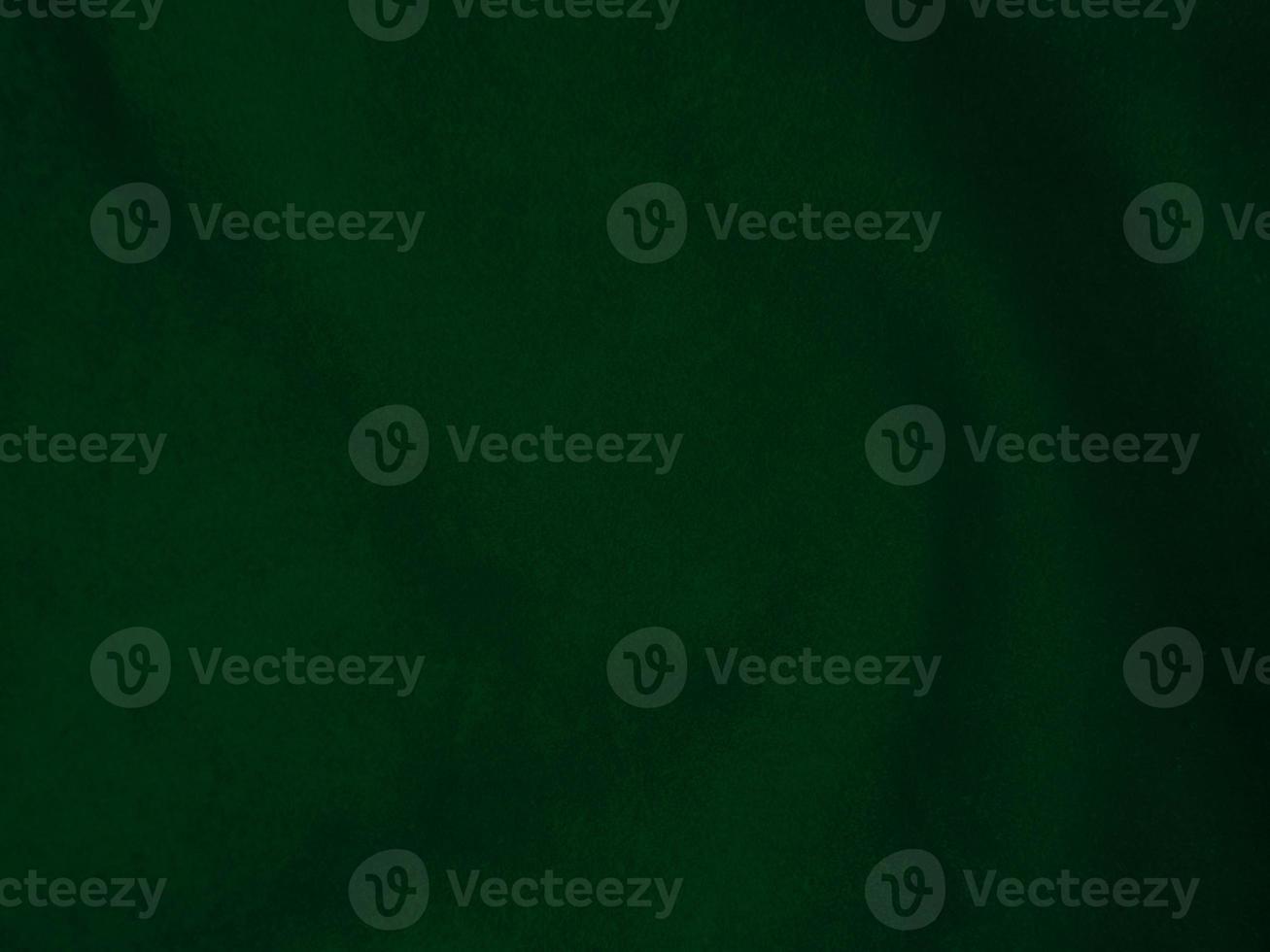 Dark green old velvet fabric texture used as background. Empty green fabric background of soft and smooth textile material. There is space for text.. photo