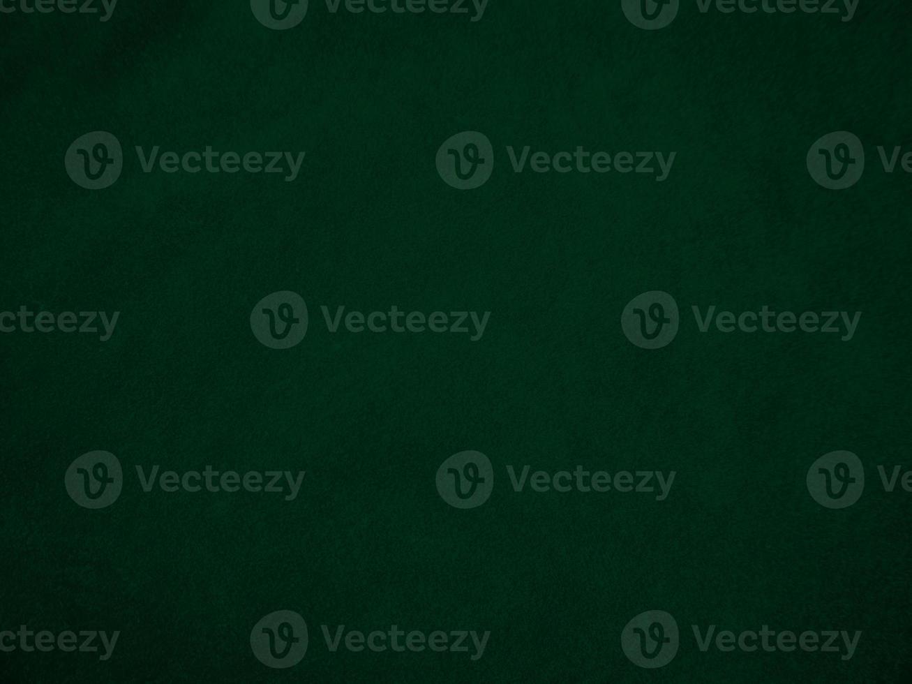 Dark green old velvet fabric texture used as background. Empty green fabric background of soft and smooth textile material. There is space for text.. photo