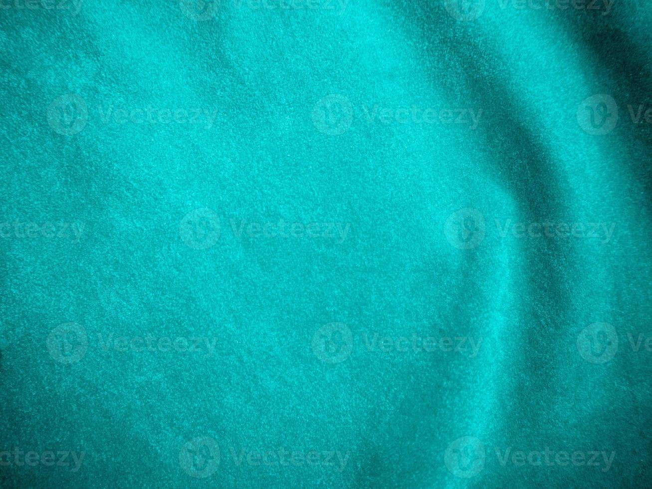 Dark green old velvet fabric texture used as background. Empty green fabric background of soft and smooth textile material. There is space for text.. photo