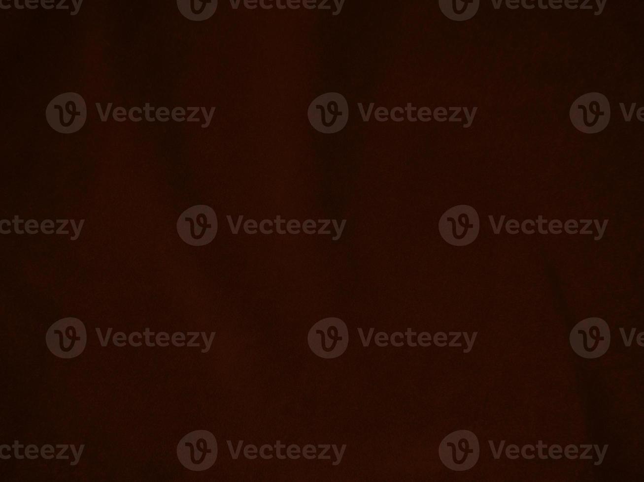 Dark red velvet fabric texture used as background. Empty dark red fabric background of soft and smooth textile material. There is space for text. photo