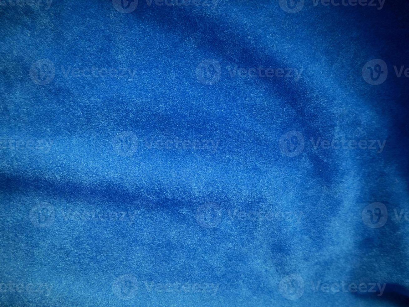 Blue velvet fabric texture used as background. Empty blue fabric background of soft and smooth textile material. There is space for text. photo