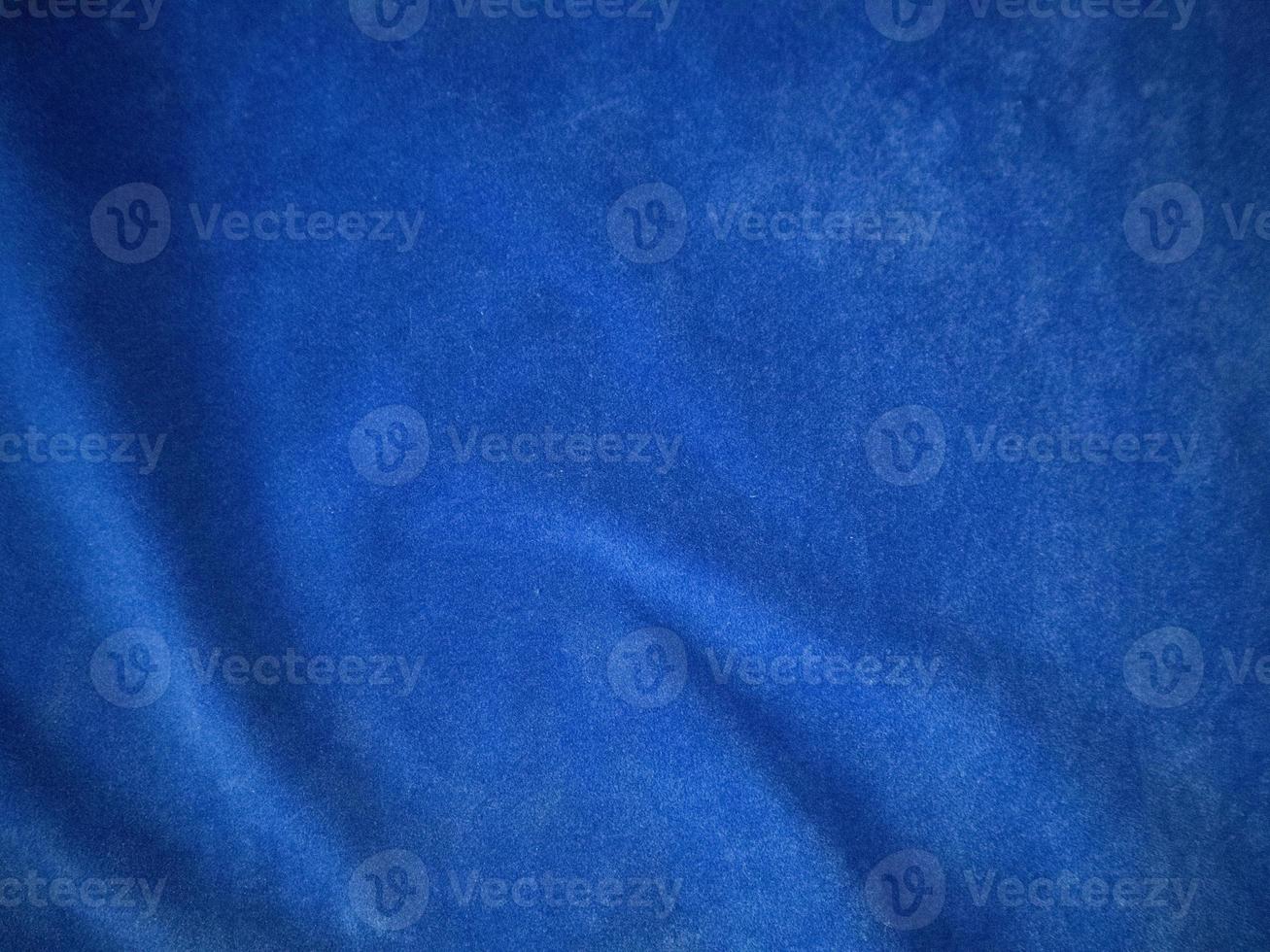 Blue velvet fabric texture used as background. Empty blue fabric background of soft and smooth textile material. There is space for text. photo