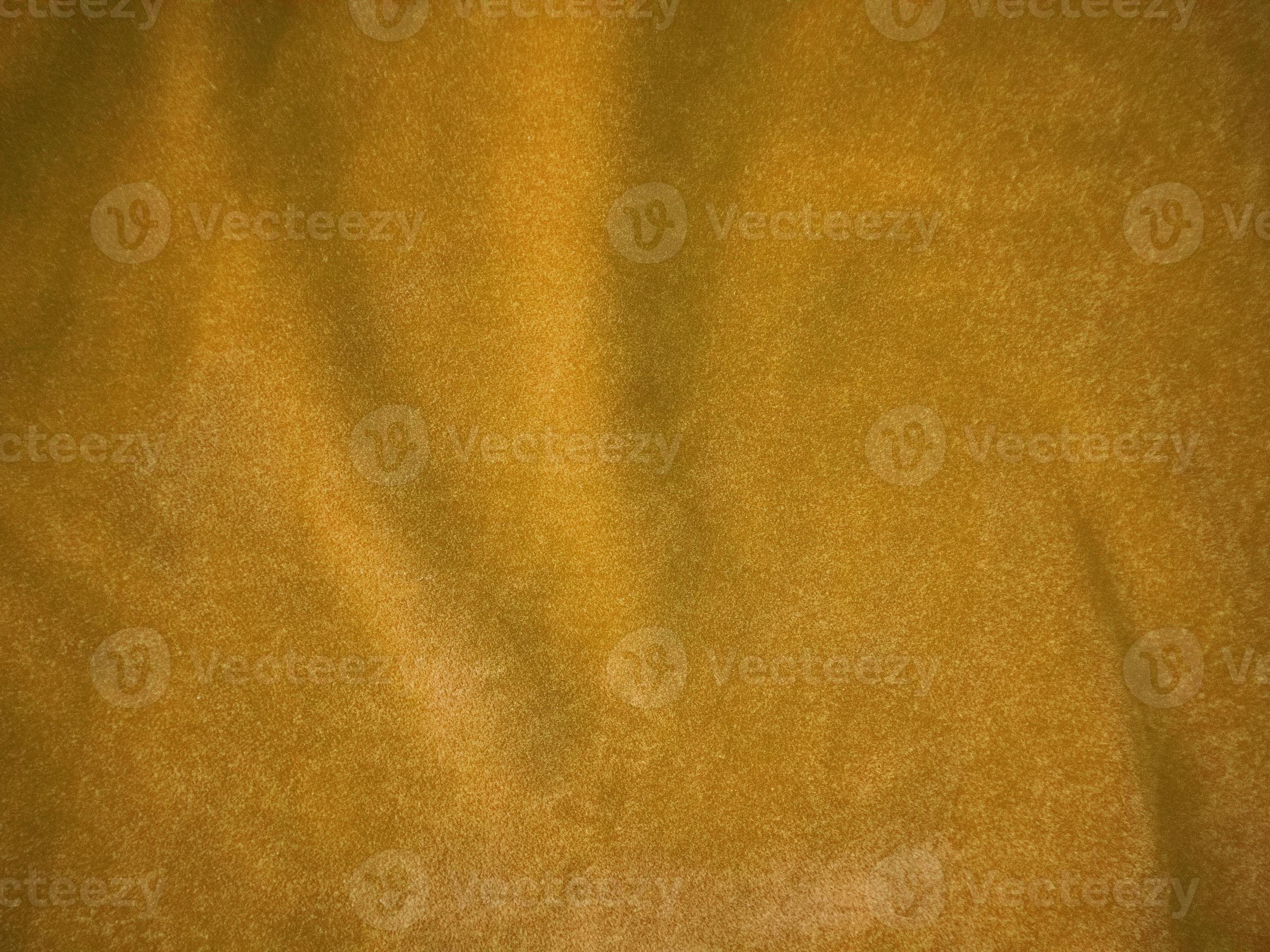 Yellow velvet fabric texture used as background. Empty yellow fabric