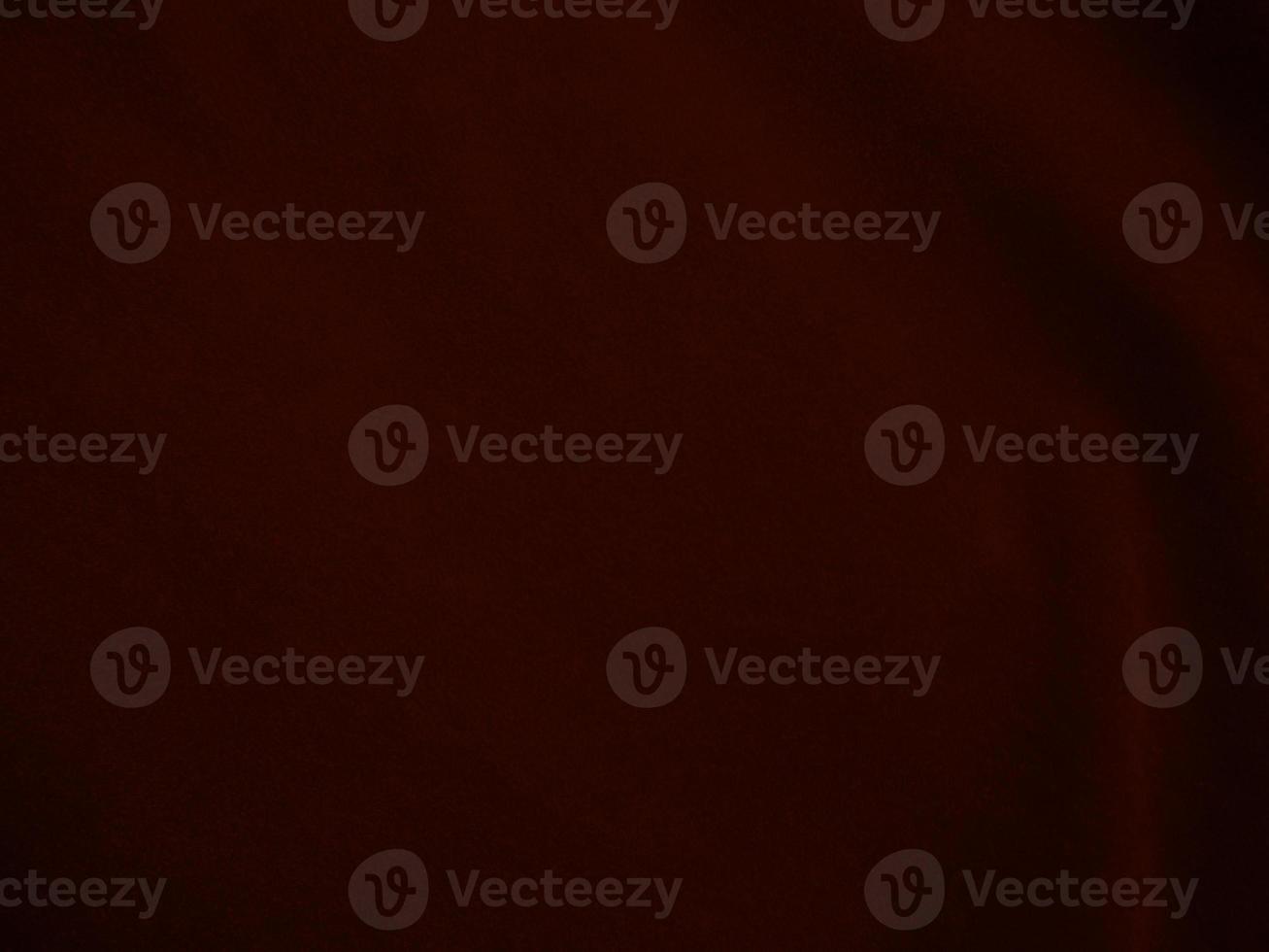 Dark red velvet fabric texture used as background. Empty dark red fabric background of soft and smooth textile material. There is space for text. photo