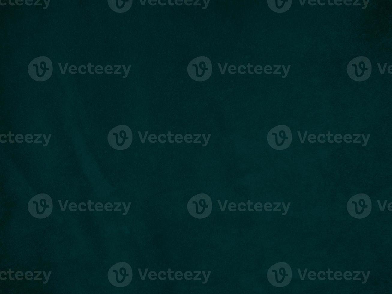 Dark green old velvet fabric texture used as background. Empty green fabric background of soft and smooth textile material. There is space for text.. photo