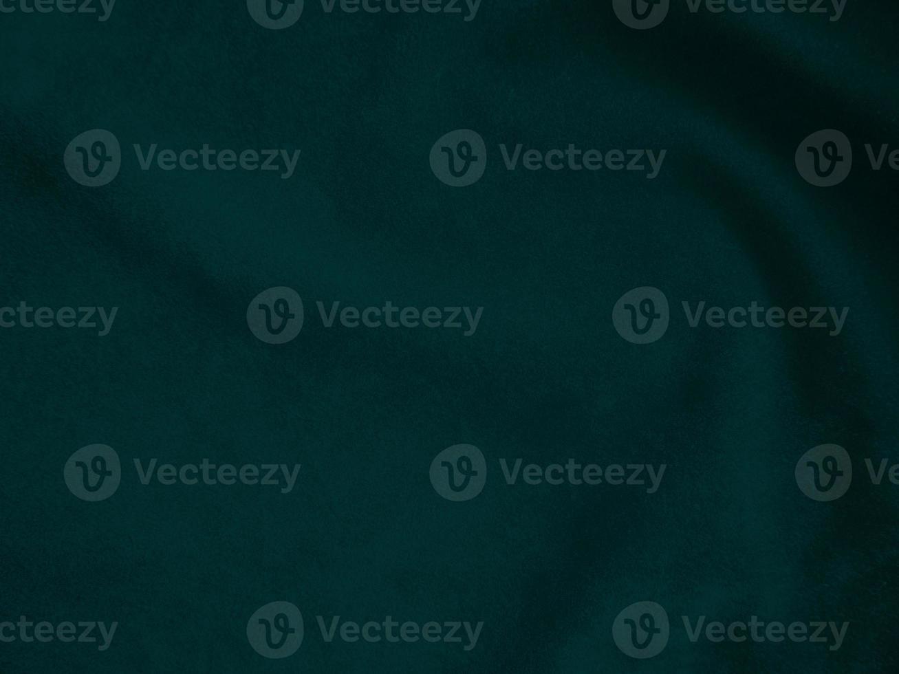 Dark green old velvet fabric texture used as background. Empty green fabric background of soft and smooth textile material. There is space for text.. photo