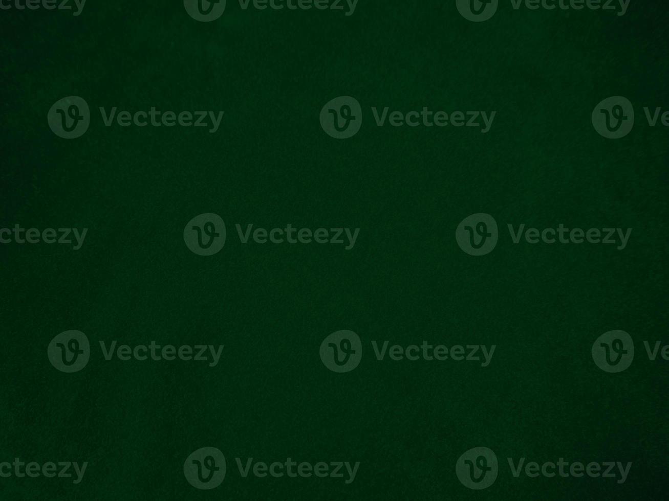 Dark green old velvet fabric texture used as background. Empty green fabric background of soft and smooth textile material. There is space for text.. photo