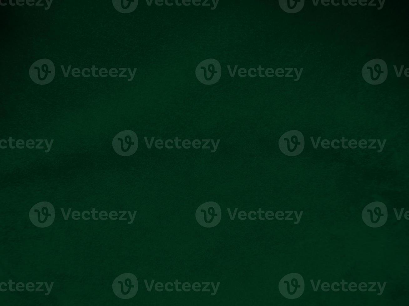 Dark green old velvet fabric texture used as background. Empty green fabric background of soft and smooth textile material. There is space for text.. photo