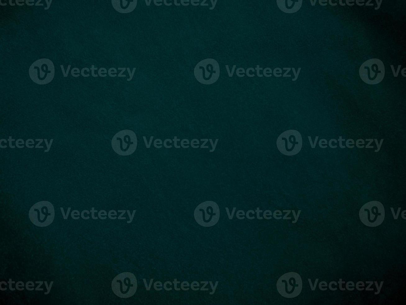 Dark green old velvet fabric texture used as background. Empty green fabric background of soft and smooth textile material. There is space for text.. photo