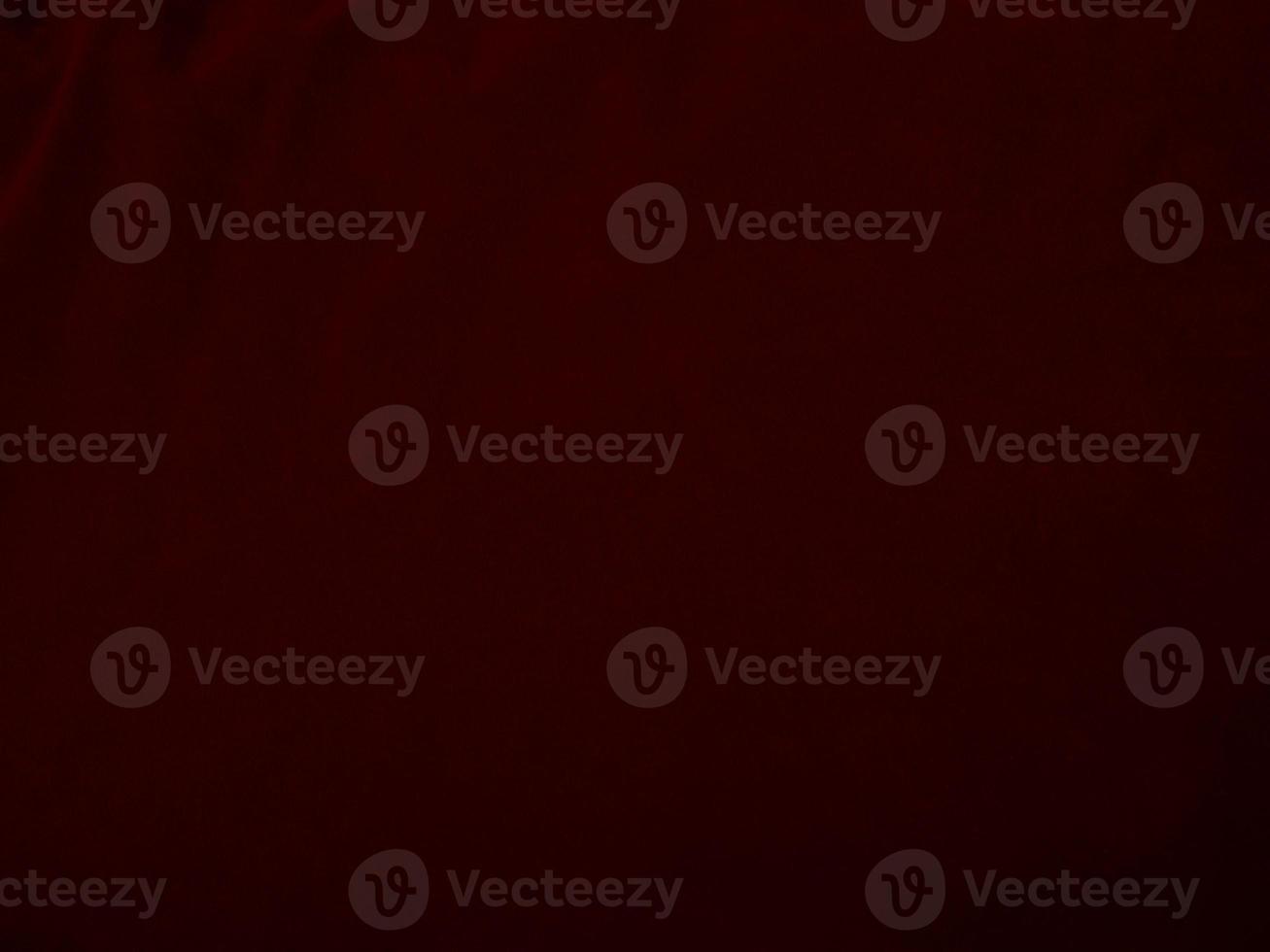 Dark red velvet fabric texture used as background. Empty dark red fabric background of soft and smooth textile material. There is space for text. photo