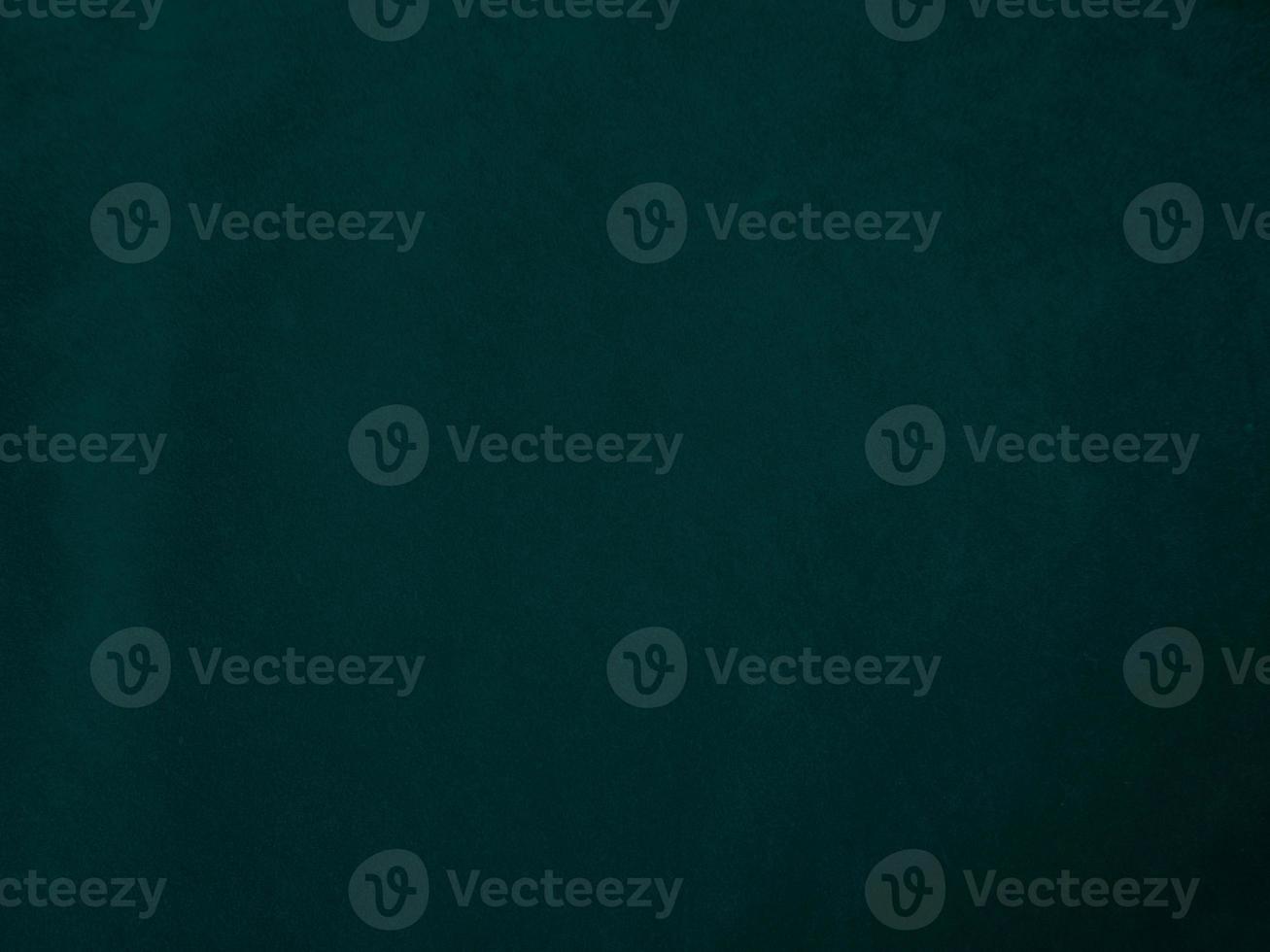 Dark green old velvet fabric texture used as background. Empty green fabric background of soft and smooth textile material. There is space for text.. photo