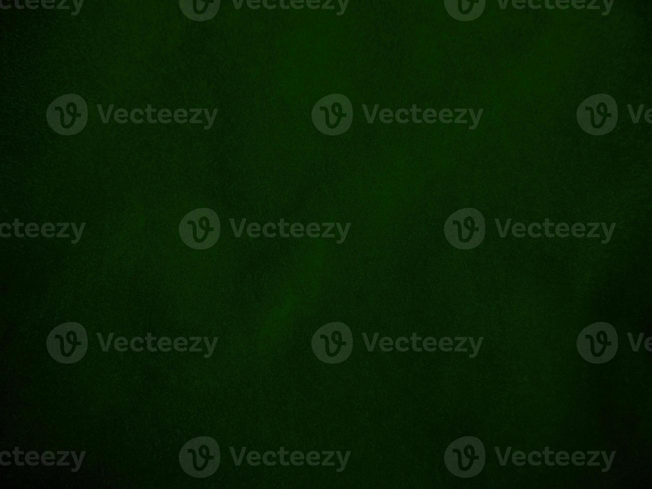 Dark green old velvet fabric texture used as background. Empty green fabric background of soft and smooth textile material. There is space for text.. photo
