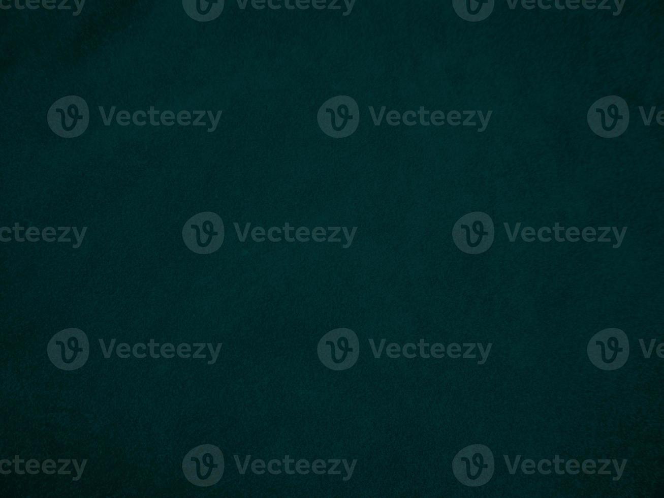Dark green old velvet fabric texture used as background. Empty green fabric background of soft and smooth textile material. There is space for text.. photo