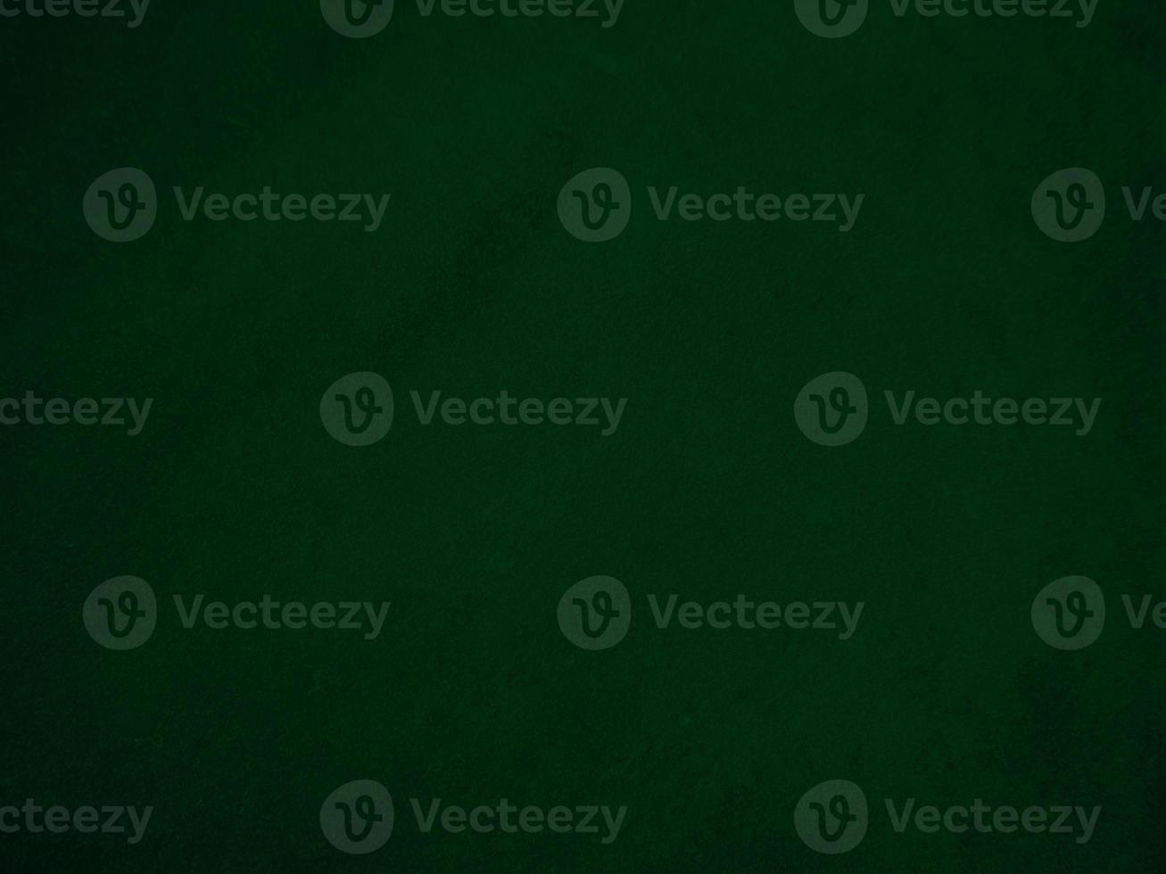 Dark green old velvet fabric texture used as background. Empty green fabric background of soft and smooth textile material. There is space for text.. photo