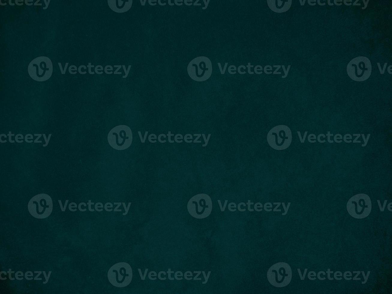 Dark green old velvet fabric texture used as background. Empty green fabric background of soft and smooth textile material. There is space for text.. photo