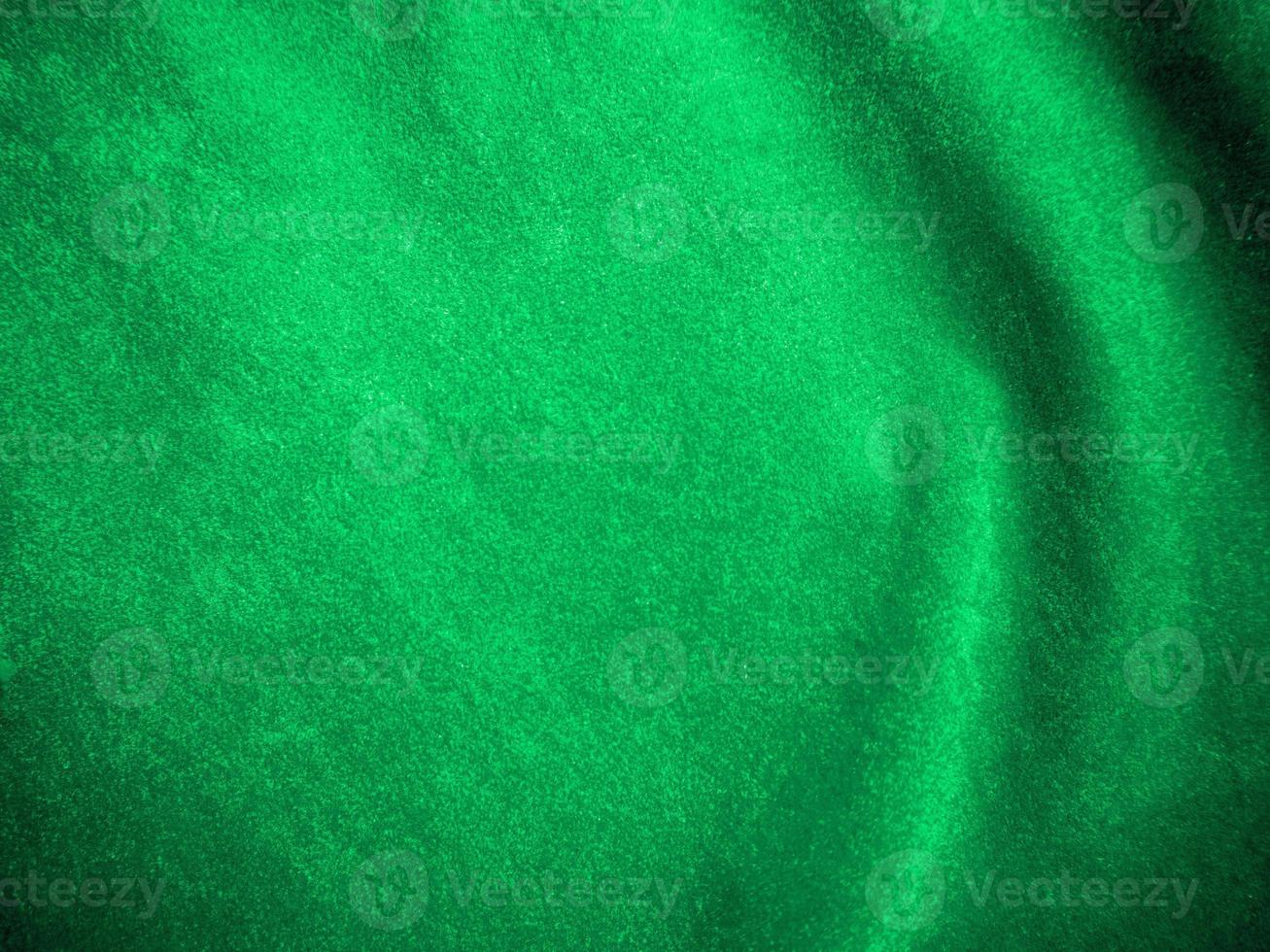 Dark green old velvet fabric texture used as background. Empty green fabric background of soft and smooth textile material. There is space for text.. photo