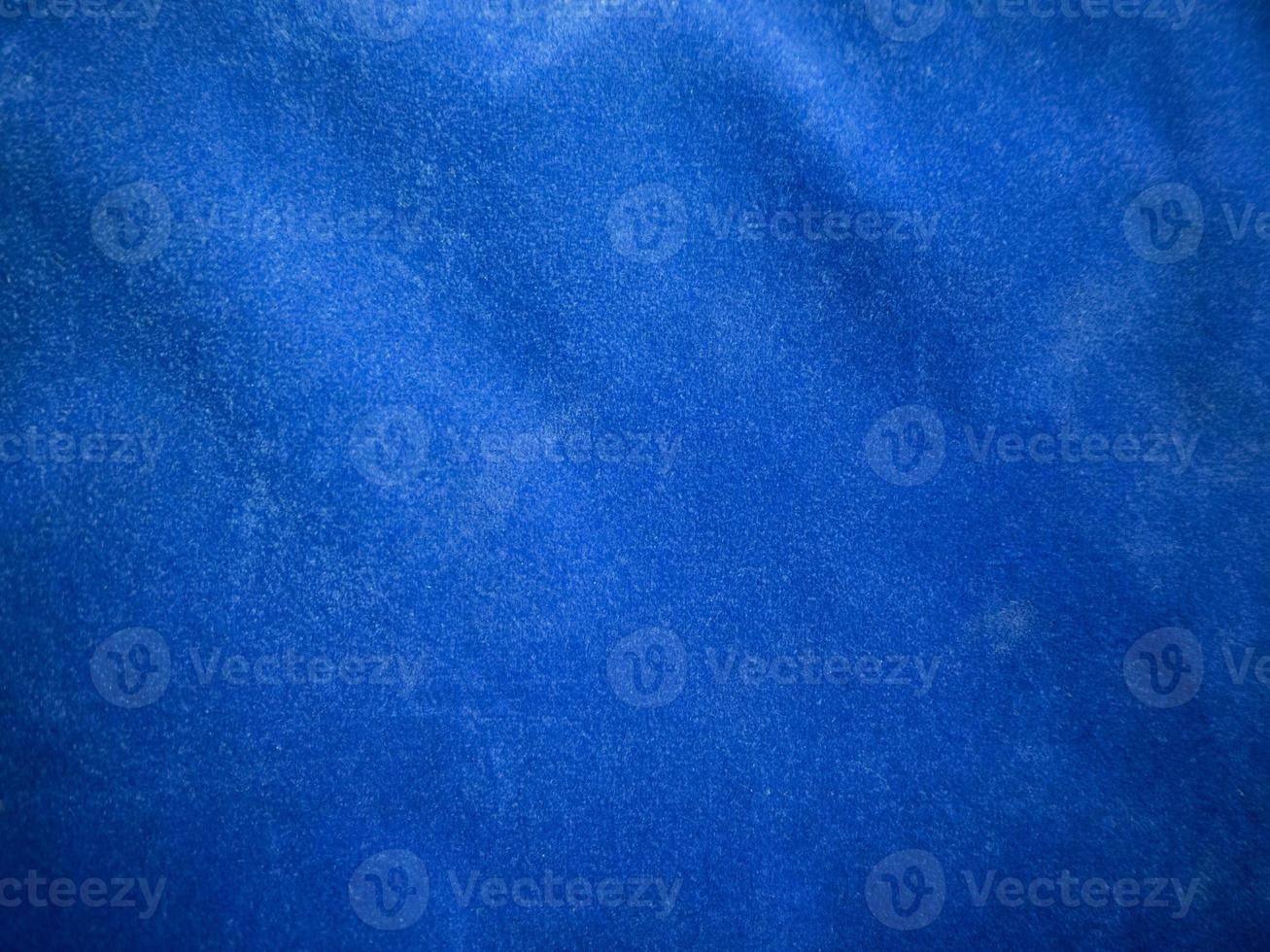 Blue velvet fabric texture used as background. Empty blue fabric background of soft and smooth textile material. There is space for text. photo