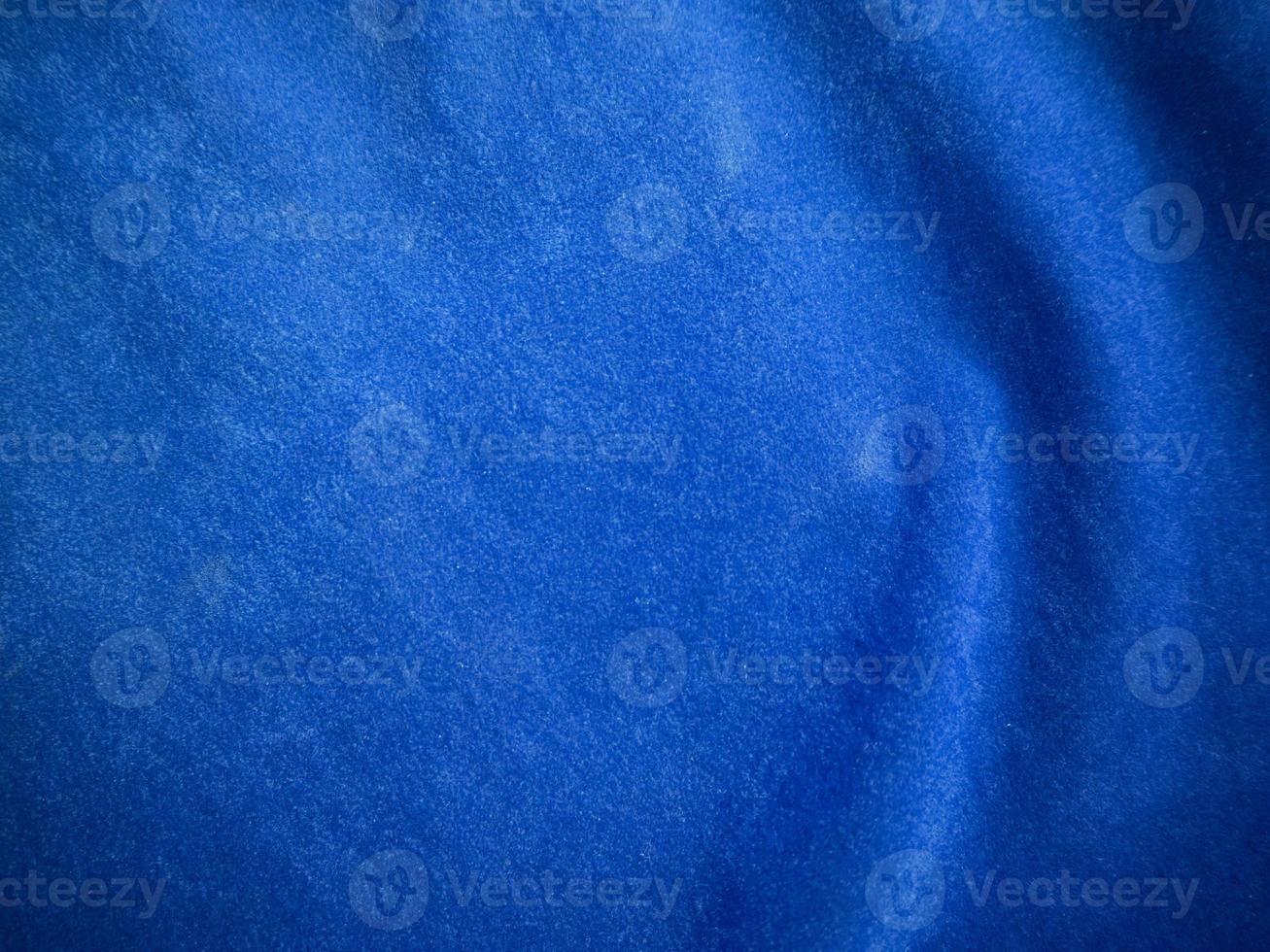 Blue velvet fabric texture used as background. Empty blue fabric background of soft and smooth textile material. There is space for text. photo