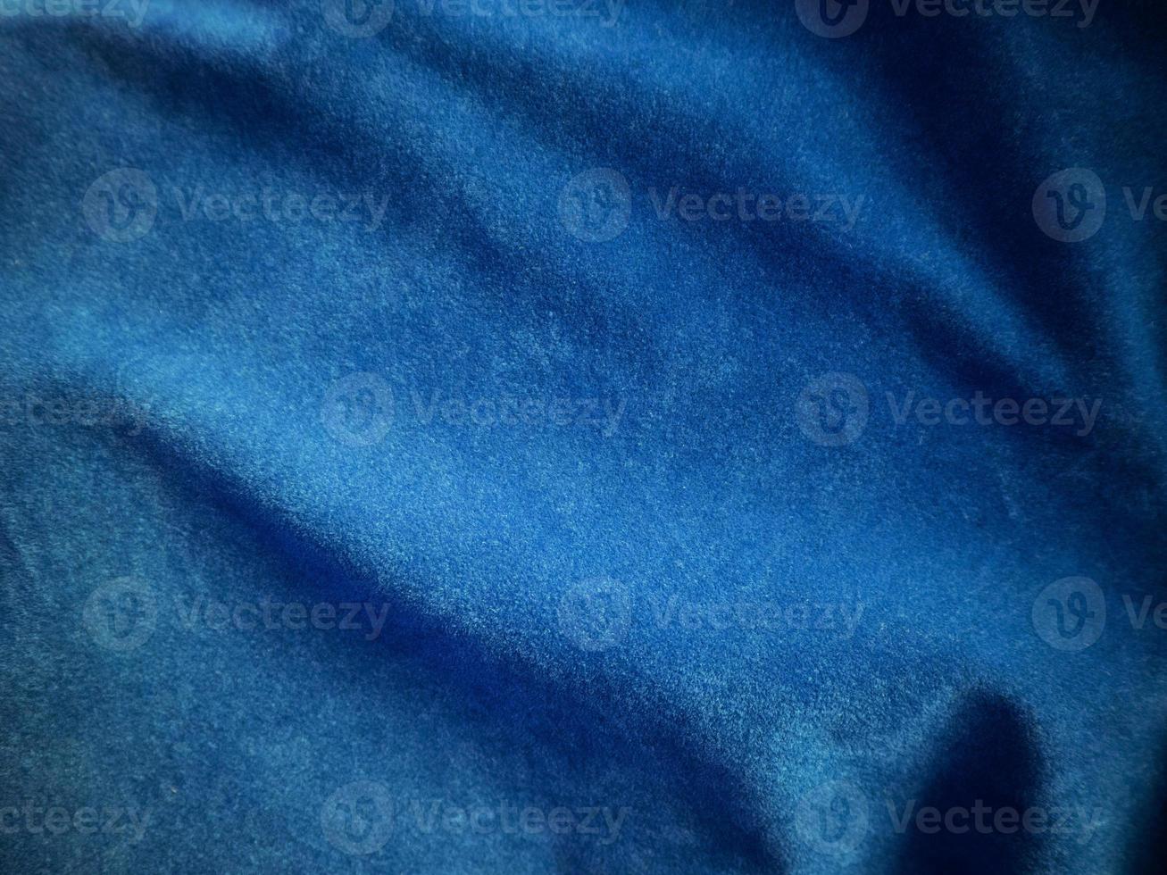 Blue velvet fabric texture used as background. Empty blue fabric background of soft and smooth textile material. There is space for text. photo
