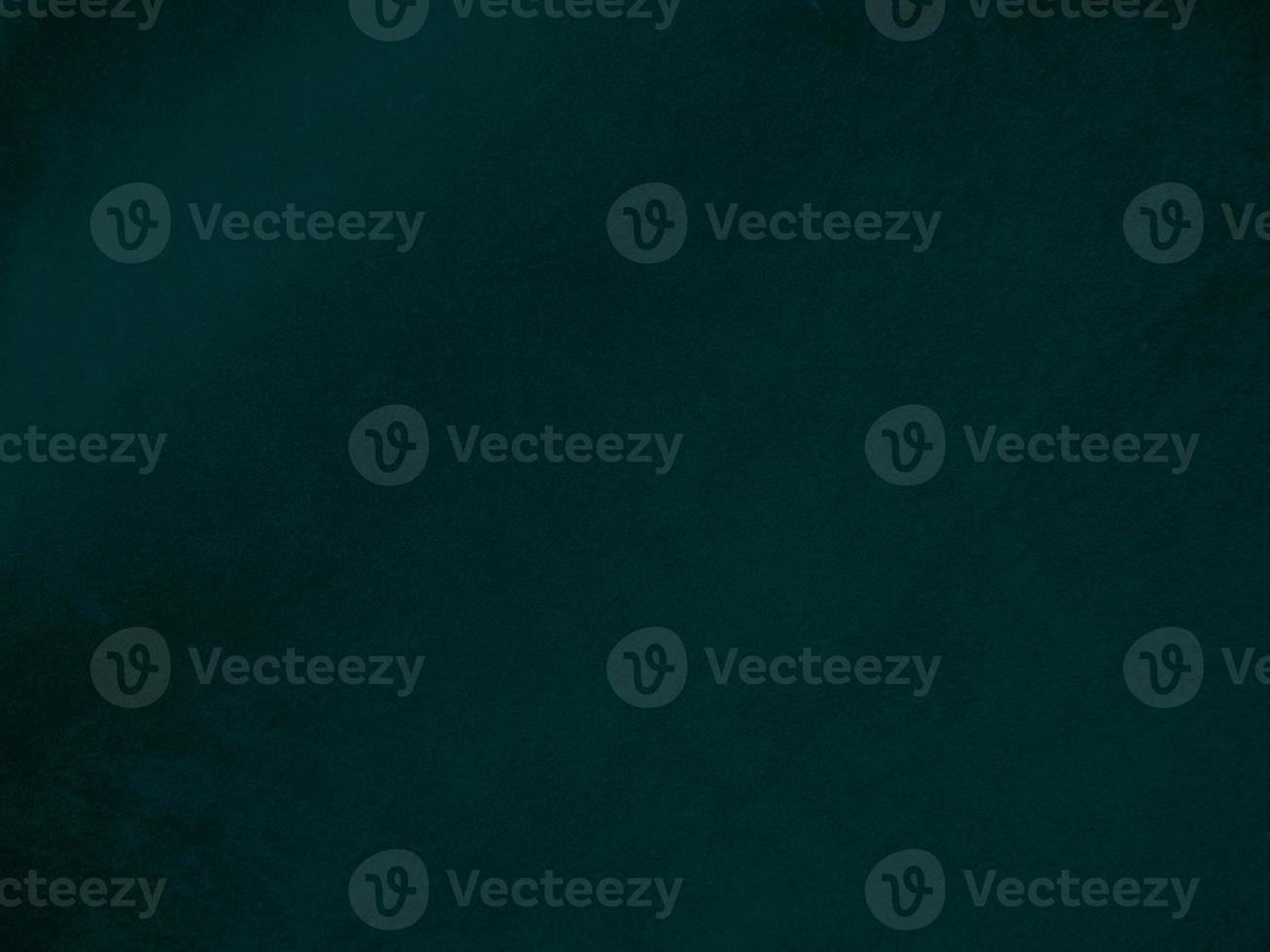Dark green old velvet fabric texture used as background. Empty green fabric background of soft and smooth textile material. There is space for text.. photo