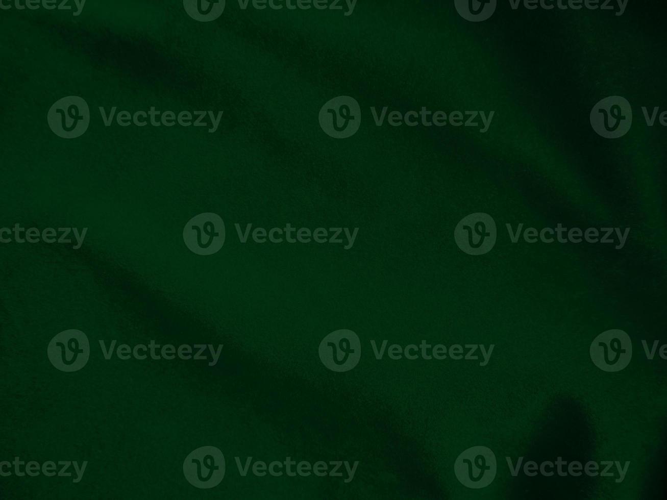Dark green old velvet fabric texture used as background. Empty green fabric background of soft and smooth textile material. There is space for text.. photo