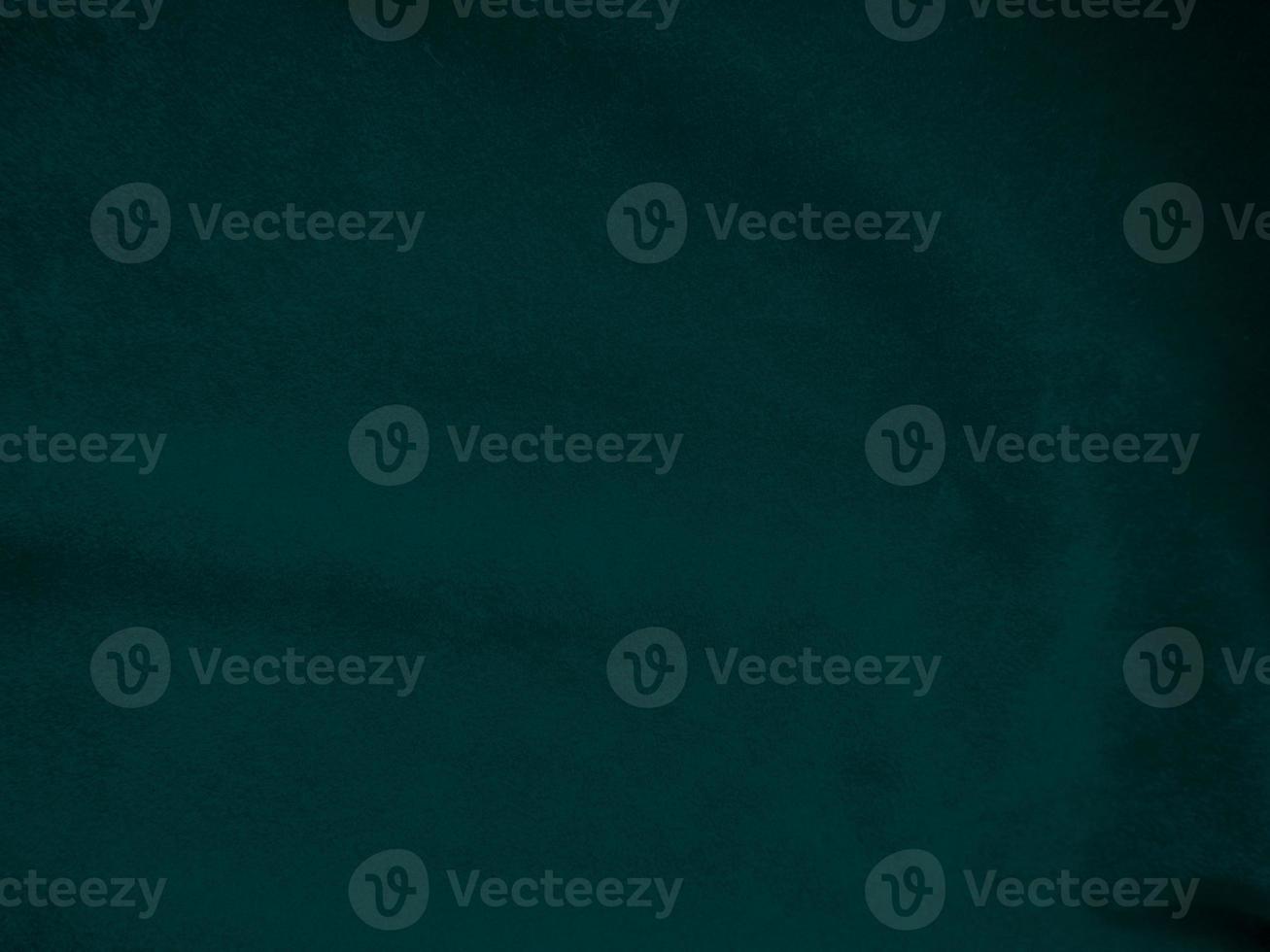 Dark green old velvet fabric texture used as background. Empty green fabric background of soft and smooth textile material. There is space for text.. photo