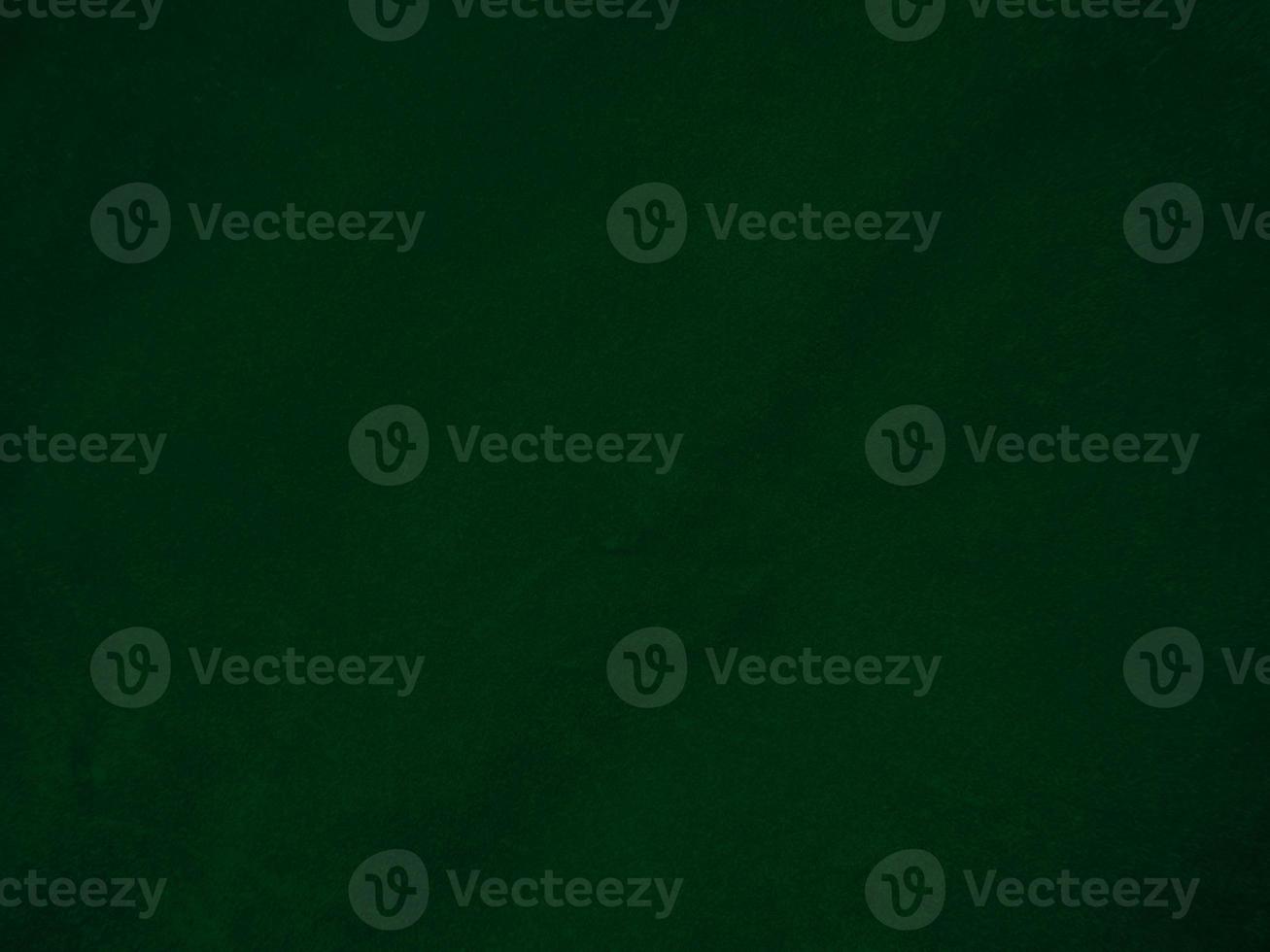 Dark green old velvet fabric texture used as background. Empty green fabric background of soft and smooth textile material. There is space for text.. photo