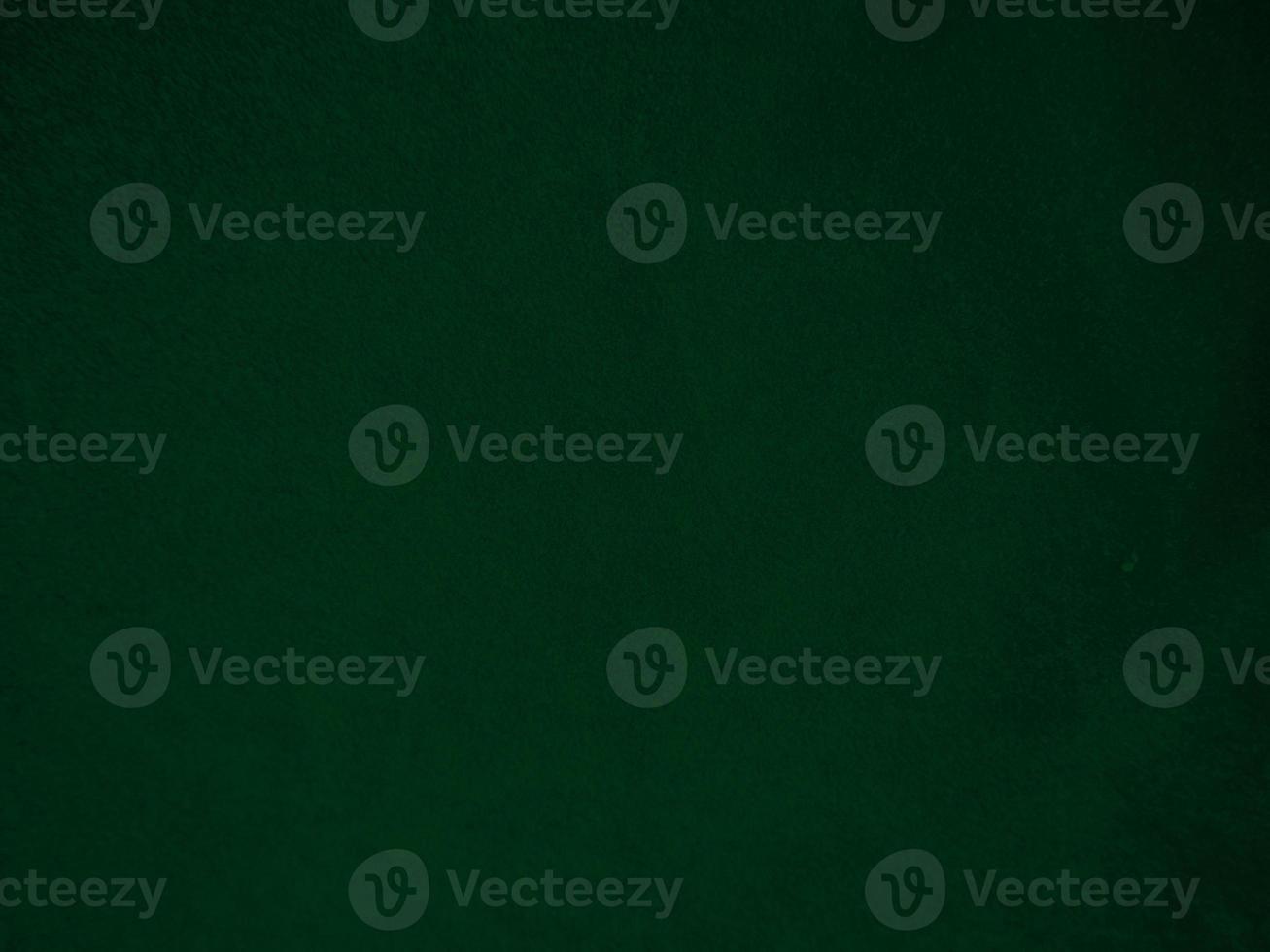Dark green old velvet fabric texture used as background. Empty green fabric background of soft and smooth textile material. There is space for text.. photo