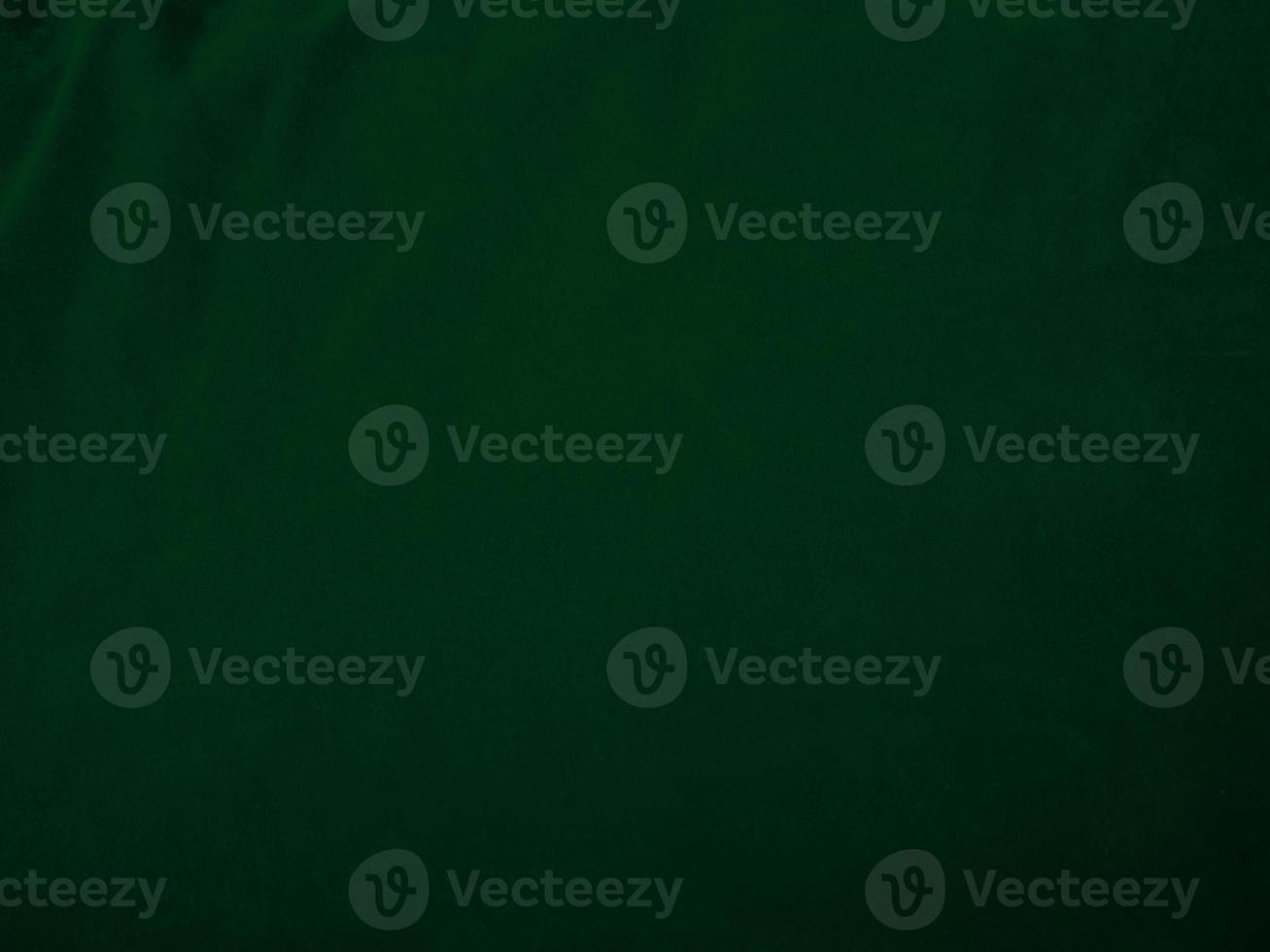 Dark green old velvet fabric texture used as background. Empty green fabric background of soft and smooth textile material. There is space for text.. photo