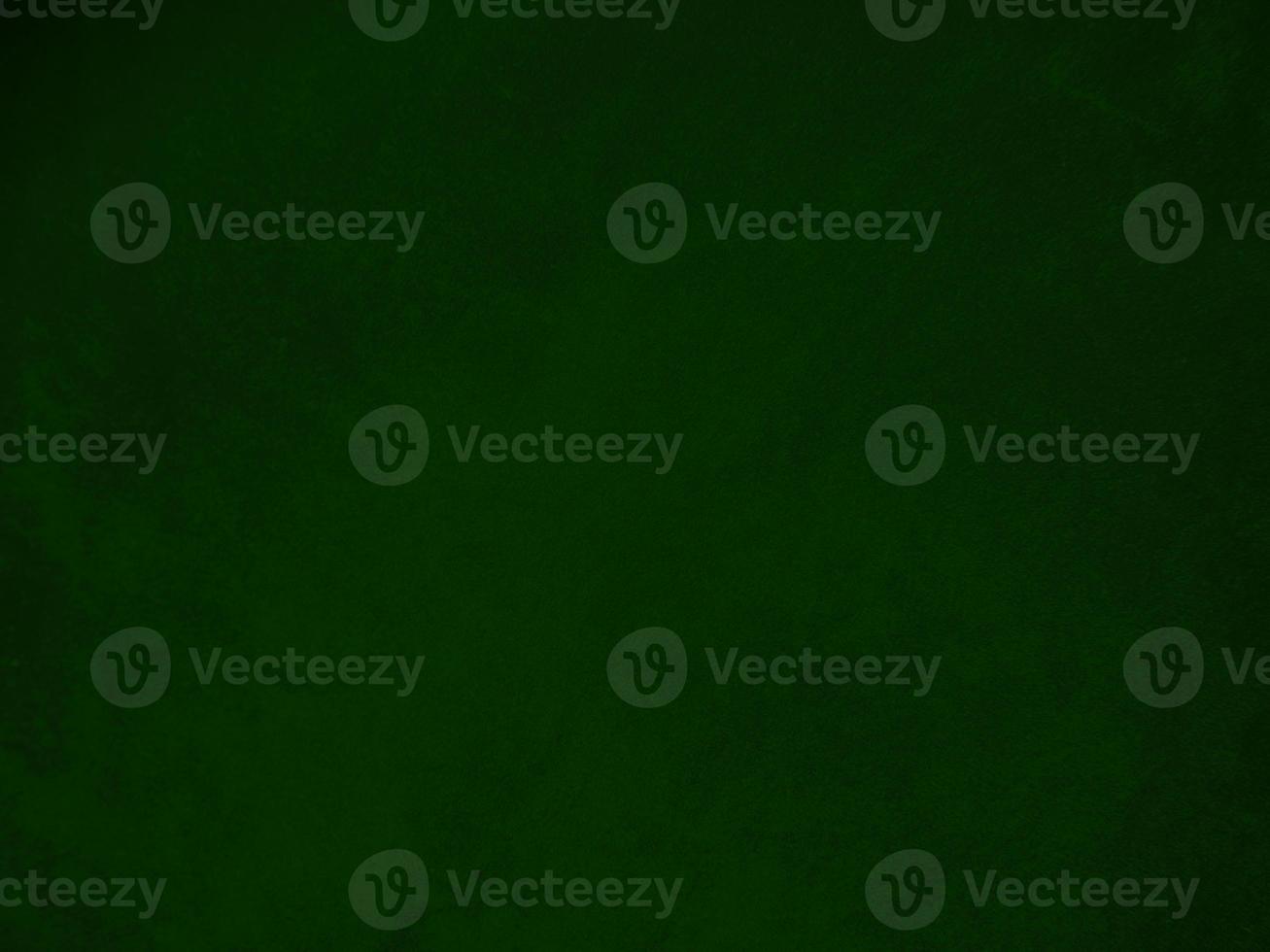 Dark green old velvet fabric texture used as background. Empty green fabric background of soft and smooth textile material. There is space for text.. photo