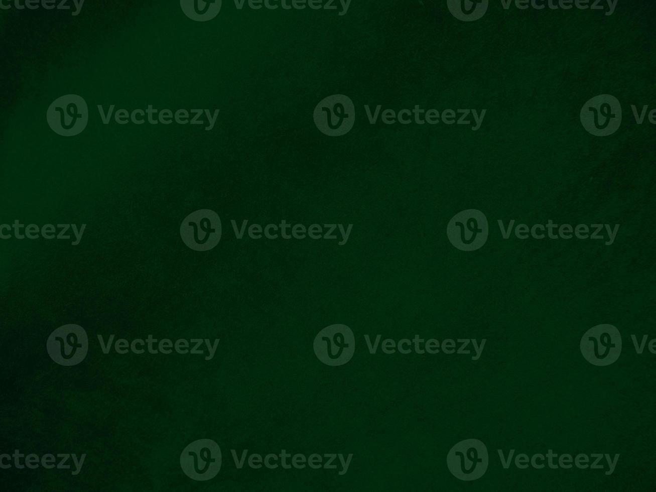 Dark green old velvet fabric texture used as background. Empty green fabric background of soft and smooth textile material. There is space for text.. photo