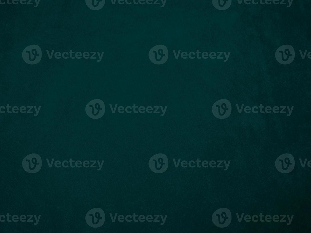 Dark green old velvet fabric texture used as background. Empty green fabric background of soft and smooth textile material. There is space for text.. photo