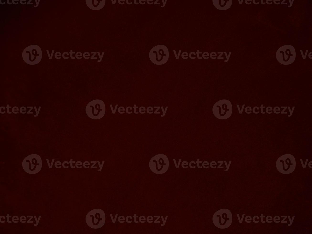 Dark red velvet fabric texture used as background. Empty dark red fabric background of soft and smooth textile material. There is space for text. photo