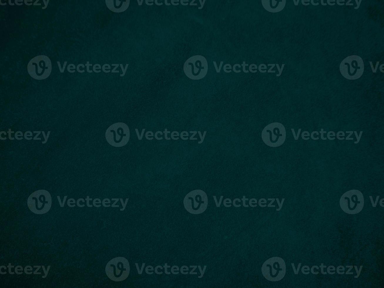 Dark green old velvet fabric texture used as background. Empty green fabric background of soft and smooth textile material. There is space for text.. photo