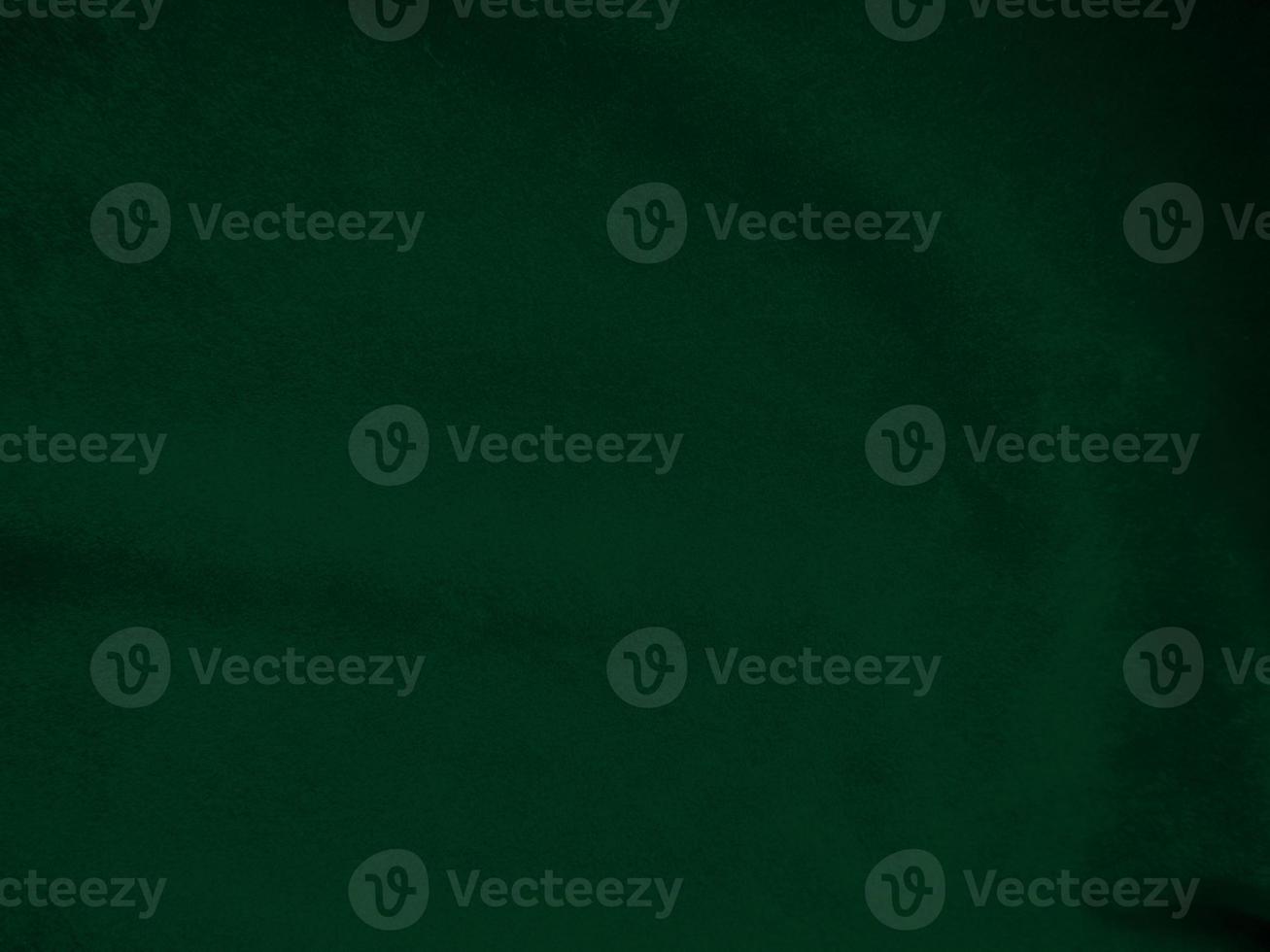 Dark green old velvet fabric texture used as background. Empty green fabric background of soft and smooth textile material. There is space for text.. photo