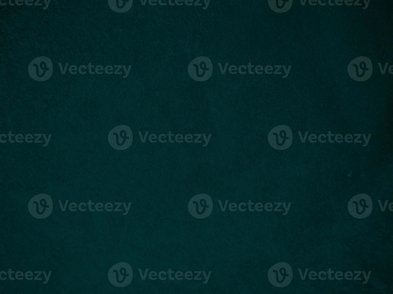 Dark green old velvet fabric texture used as background. Empty green fabric background of soft and smooth textile material. There is space for text.. photo