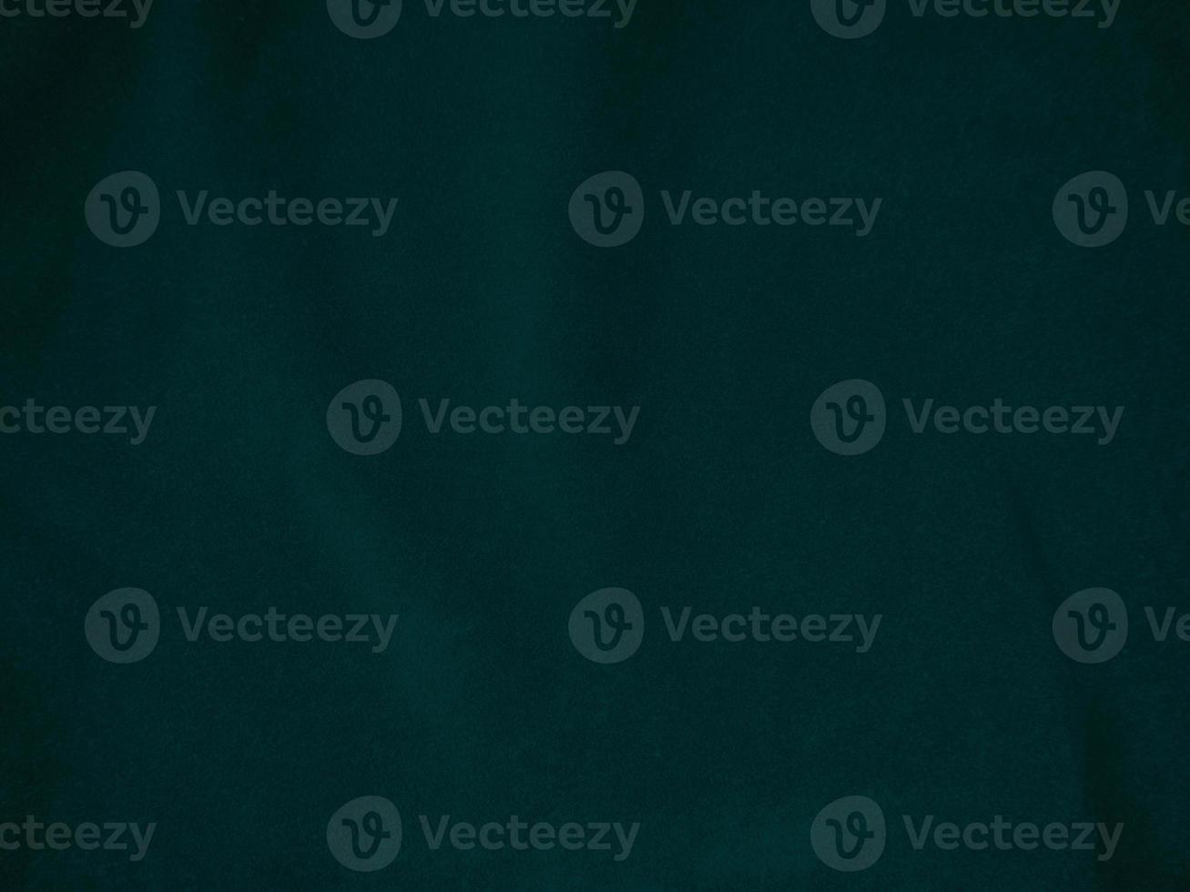 Dark green old velvet fabric texture used as background. Empty green fabric background of soft and smooth textile material. There is space for text.. photo