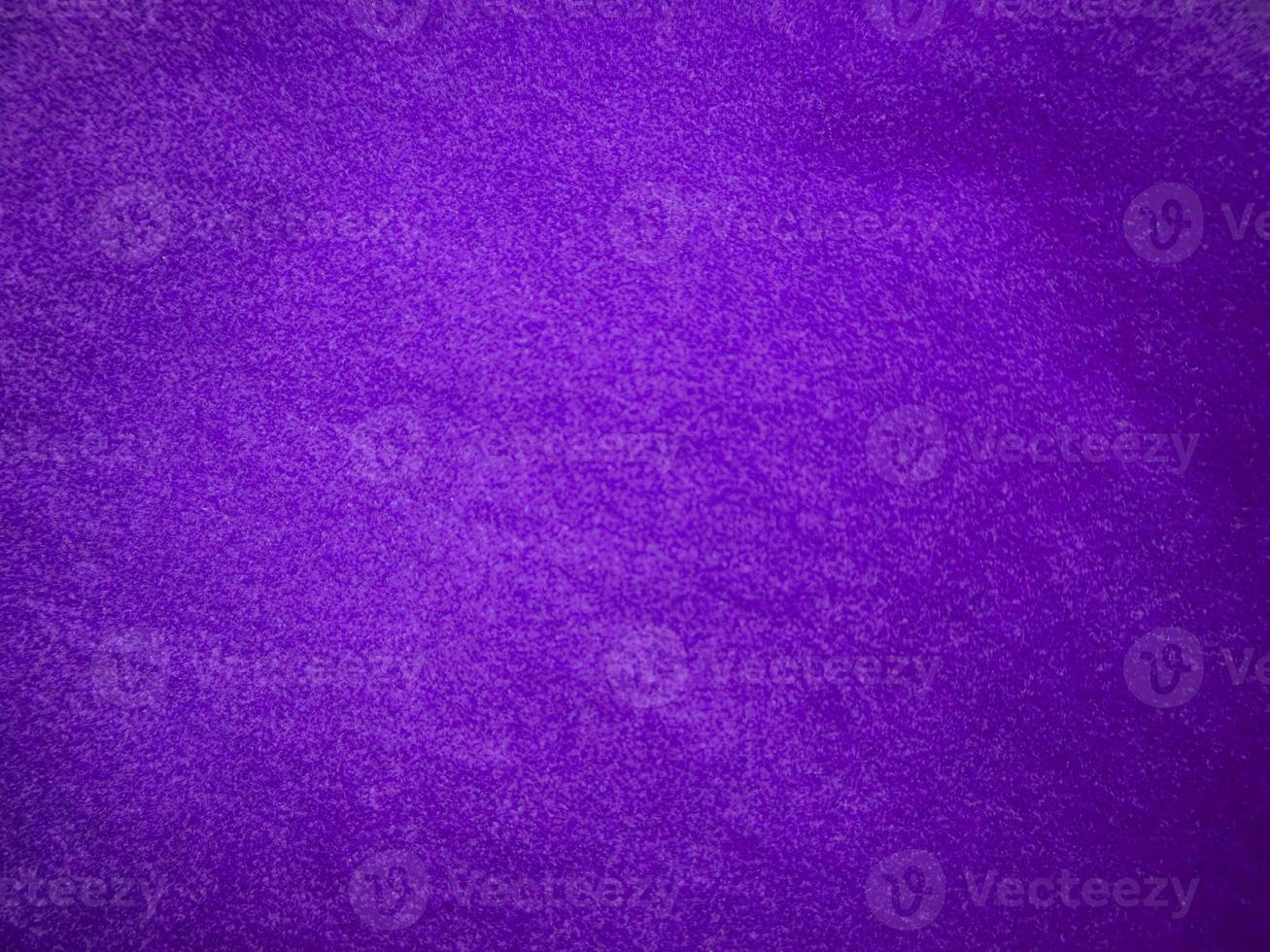 Purple velvet fabric texture used as background. Luxury violet fabric background of soft and smooth textile material. There is space for text. photo