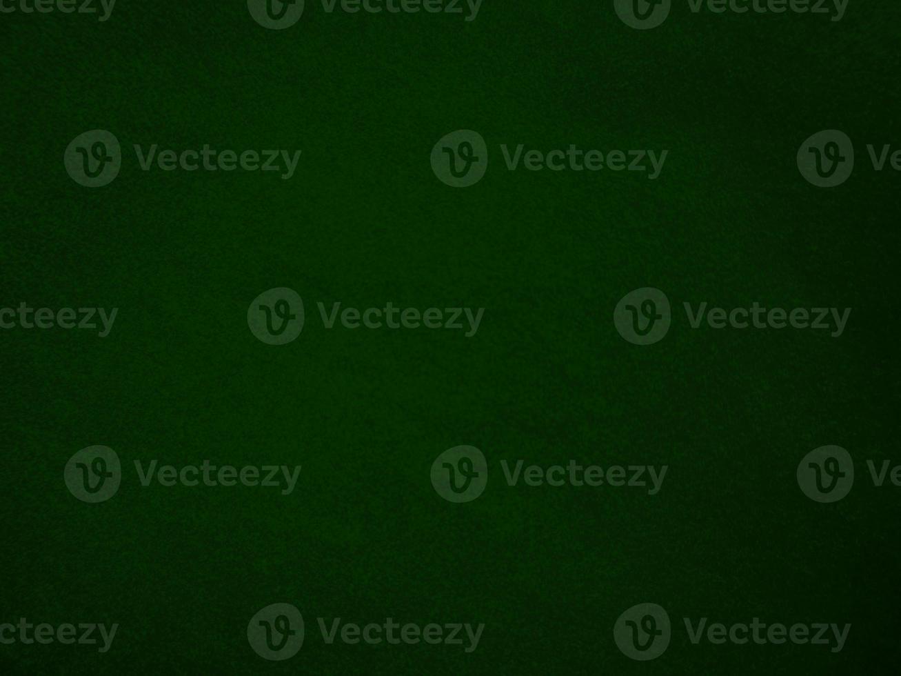 Dark green old velvet fabric texture used as background. Empty green fabric background of soft and smooth textile material. There is space for text.. photo