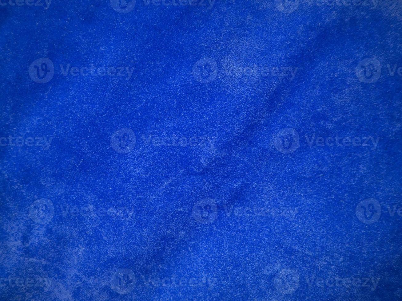 Blue velvet fabric texture used as background. Empty blue fabric background of soft and smooth textile material. There is space for text. photo