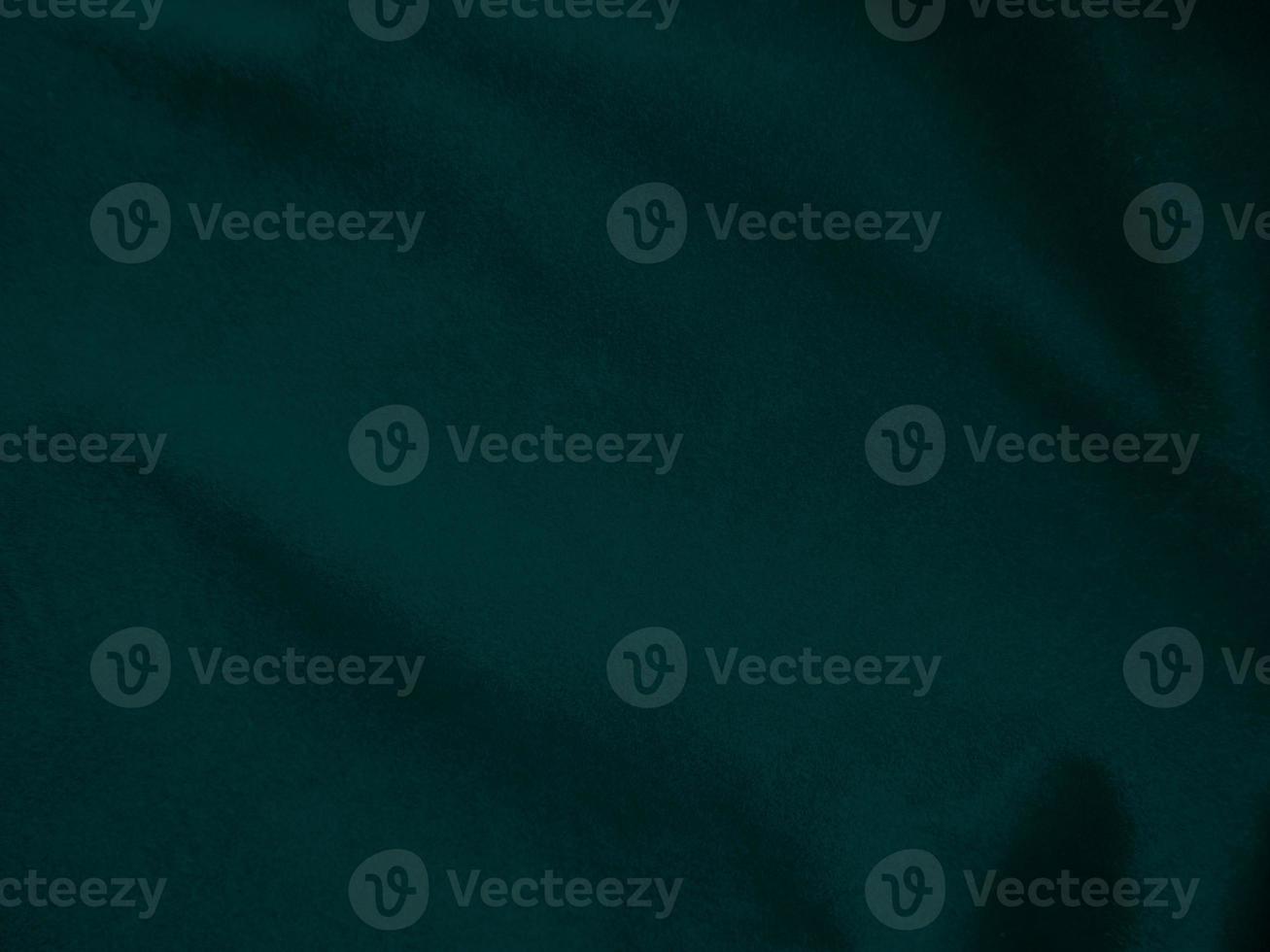 Dark green old velvet fabric texture used as background. Empty green fabric background of soft and smooth textile material. There is space for text.. photo