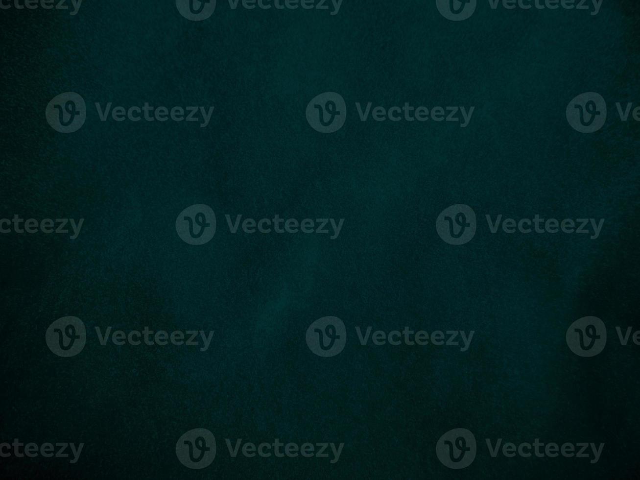 Dark green old velvet fabric texture used as background. Empty green fabric background of soft and smooth textile material. There is space for text.. photo
