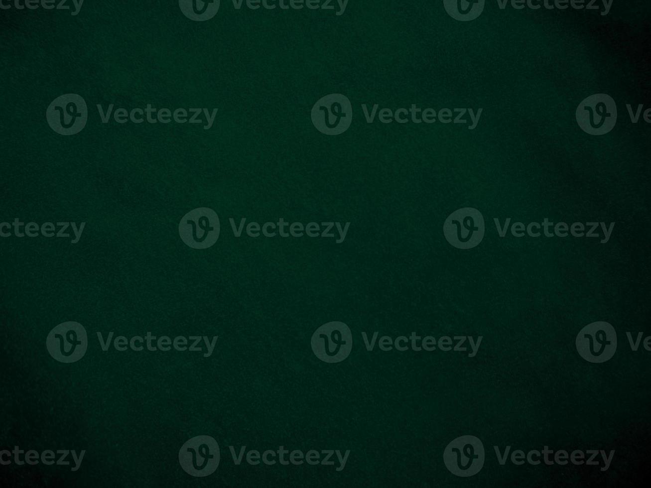 Dark green old velvet fabric texture used as background. Empty green fabric background of soft and smooth textile material. There is space for text.. photo