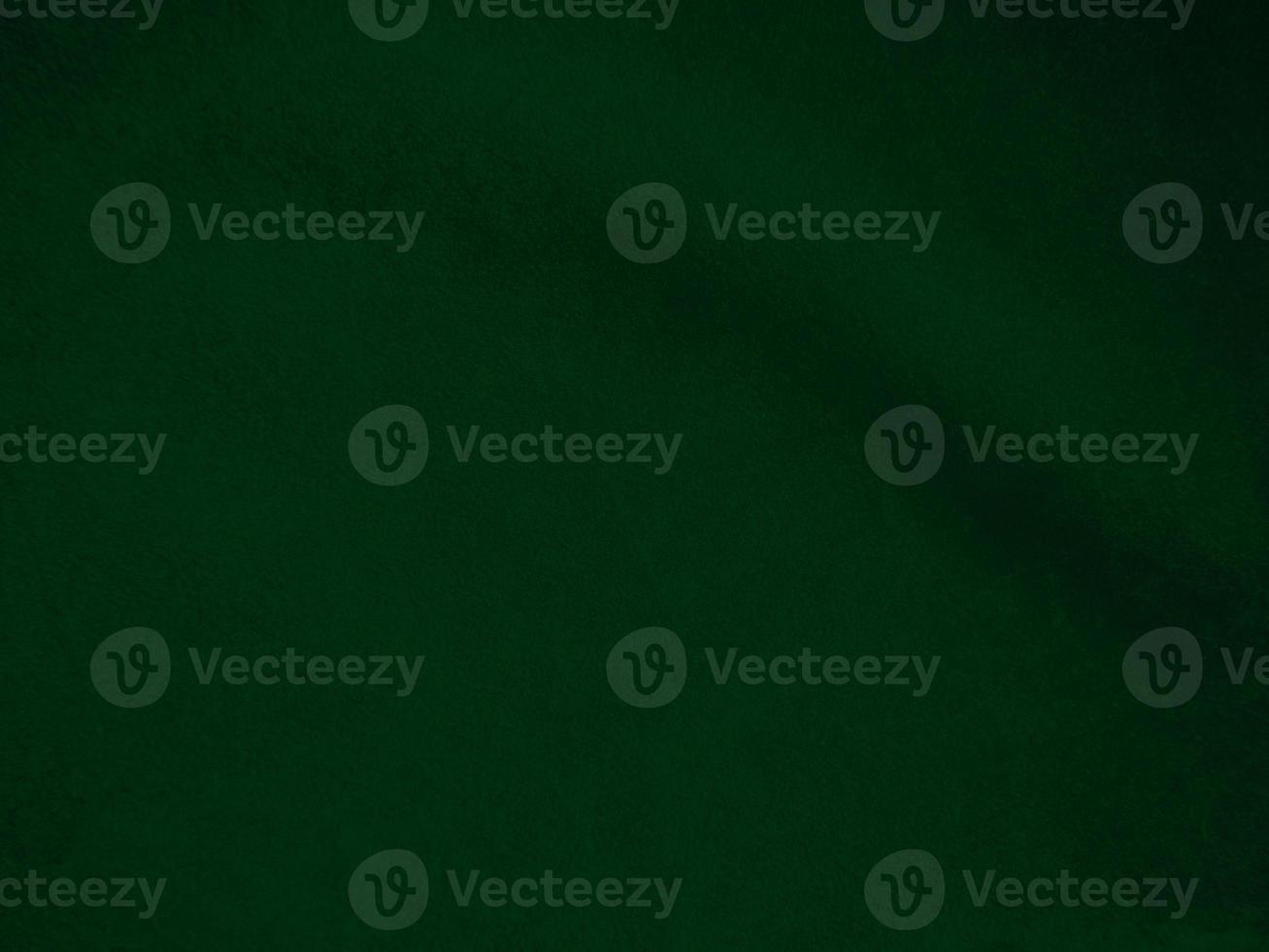 Dark green old velvet fabric texture used as background. Empty green fabric background of soft and smooth textile material. There is space for text.. photo