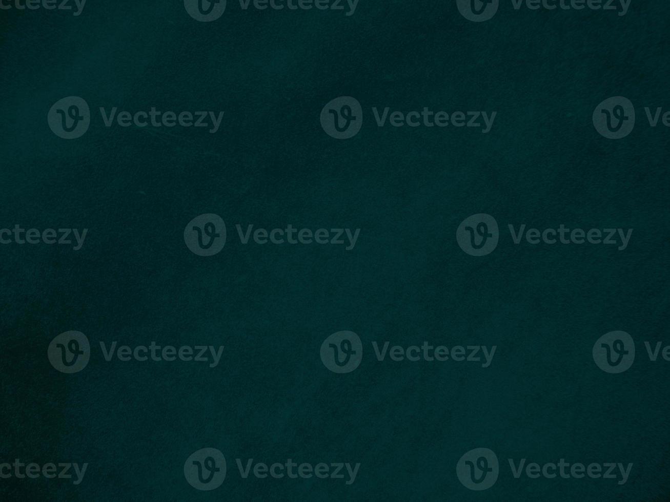 Dark green old velvet fabric texture used as background. Empty green fabric background of soft and smooth textile material. There is space for text.. photo